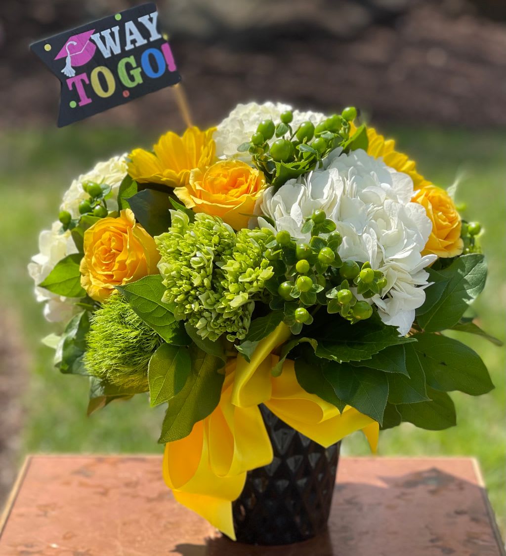 The Graduate  - A bright and cheerful congratulations for the graduate in your life.  Tax free. Same day hand delivery.  We are a local florist in Wilmington, Delaware that provides the best delivery of fresh flowers on the same day. We also offer next day delivery. Our flower shop services the Wilmington and Newark Delaware areas as well as south eastern PA. We are a flower shop near you that is tax free and provides hand delivered flowers. We offer funeral, sympathy, anniversary, birthday, holiday, Mother's Day, Valentine's Day and rose arrangements and flowers for all occasions. Petals is a full service florist that offers the best online flowers and fresh flower arrangements. You can send flowers from our flower shop to Wilmington, New Castle, Newark, Hockessin, Chadds Ford, Kennett Square and other local cities near us. 