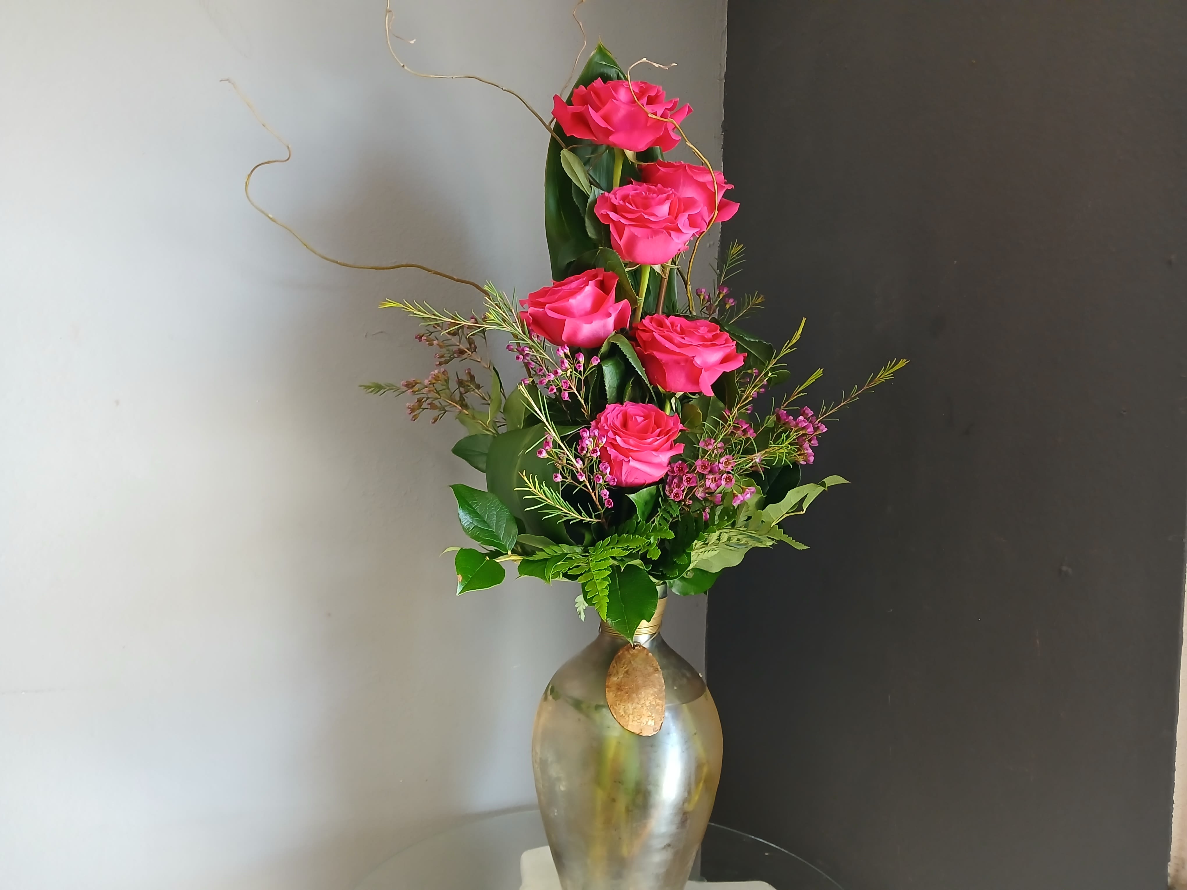 Half a Dozen Pink Roses - This beautiful flower arrangement of fresh mixed seasonal blooms is made by local designers in the heart of Orange California. Hand crafted and perfect for every occasion, from birthdays and new babies to sympathy and just because. The best choice to show you are thinking of that special someone. Can be sent as a local delivery or in-store pickup. This is an original, one of a kind arrangement. Order now before it's too late!