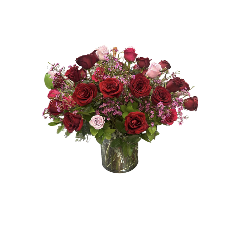 Bouquet of red and pink roses in a glass vase