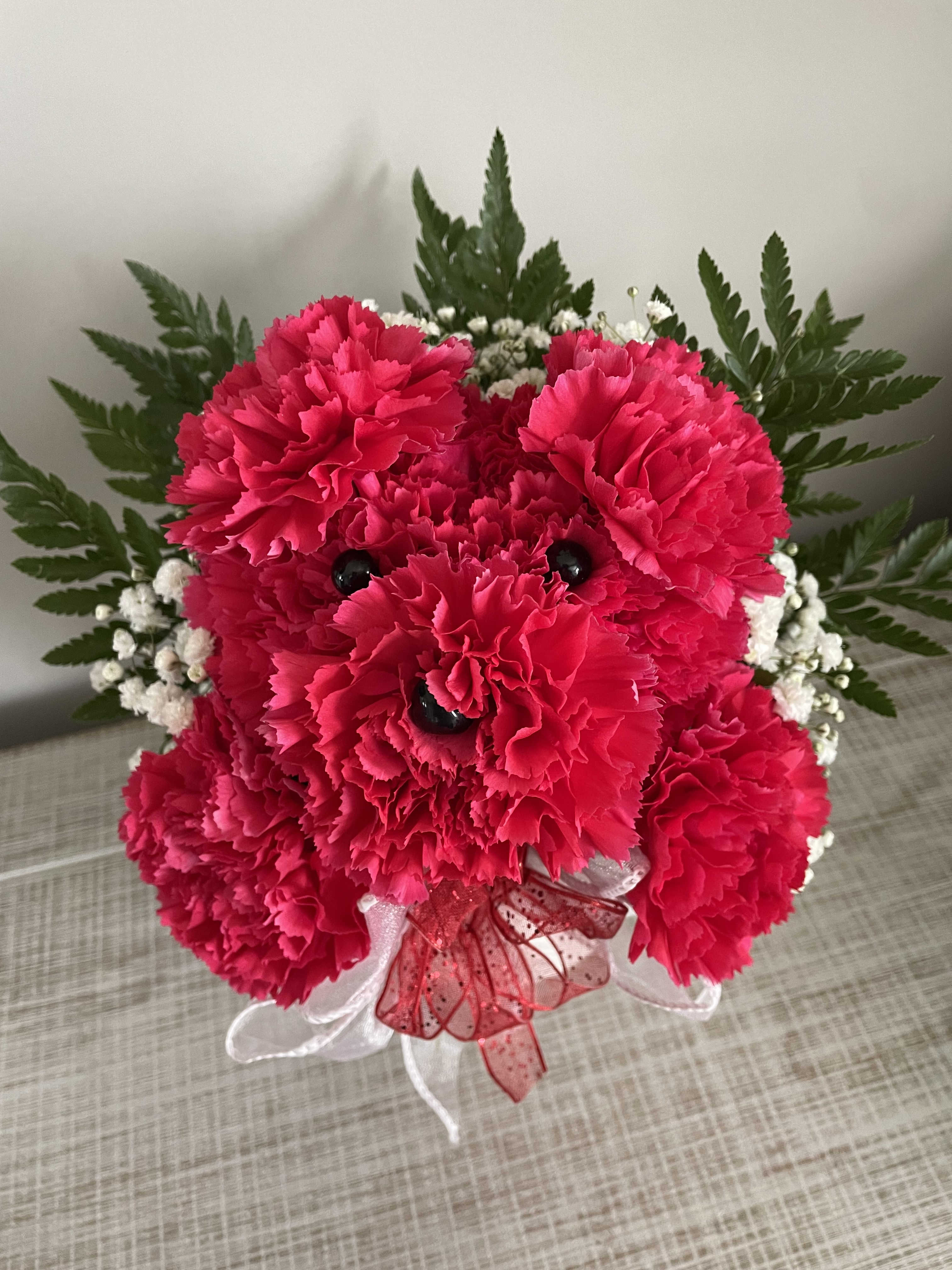 Puppy Love - This cute carnation arrangement is sure to bring joy to the recipient!