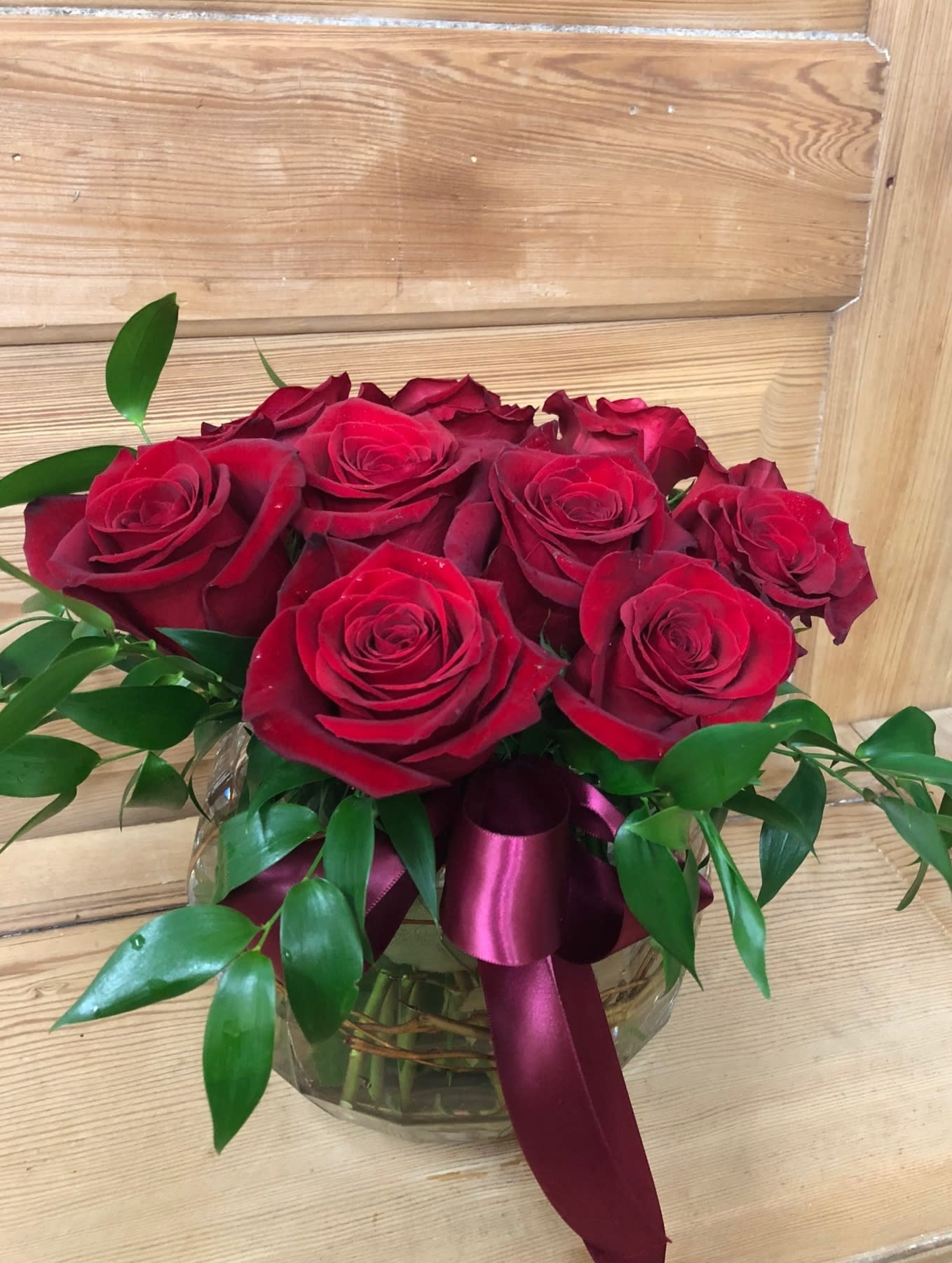 Pave Roses in Bowl - The perfect way to say I love you. The short Pave` style allows the recipients to keep on a desk or table and still see over it. It's the same 12 Roses used in taller arrangements just arranged short for style and convenience.   Would you prefer a different color than red? No worries, just put your request in the special instructions and we will try our best!