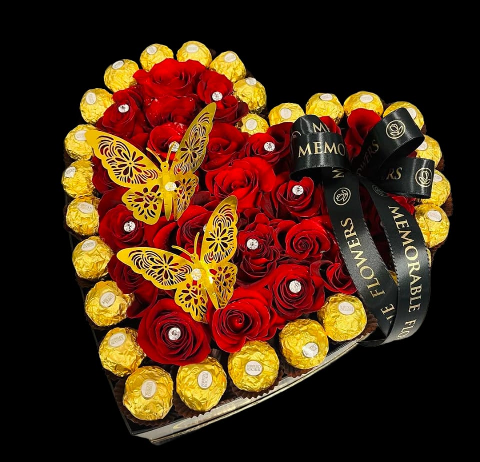 CORAZON - Large Size Heart Carries Red Roses and Ferrero Chocolates. **Chocolates may contain peanuts.  ** Heart box color may vary. 