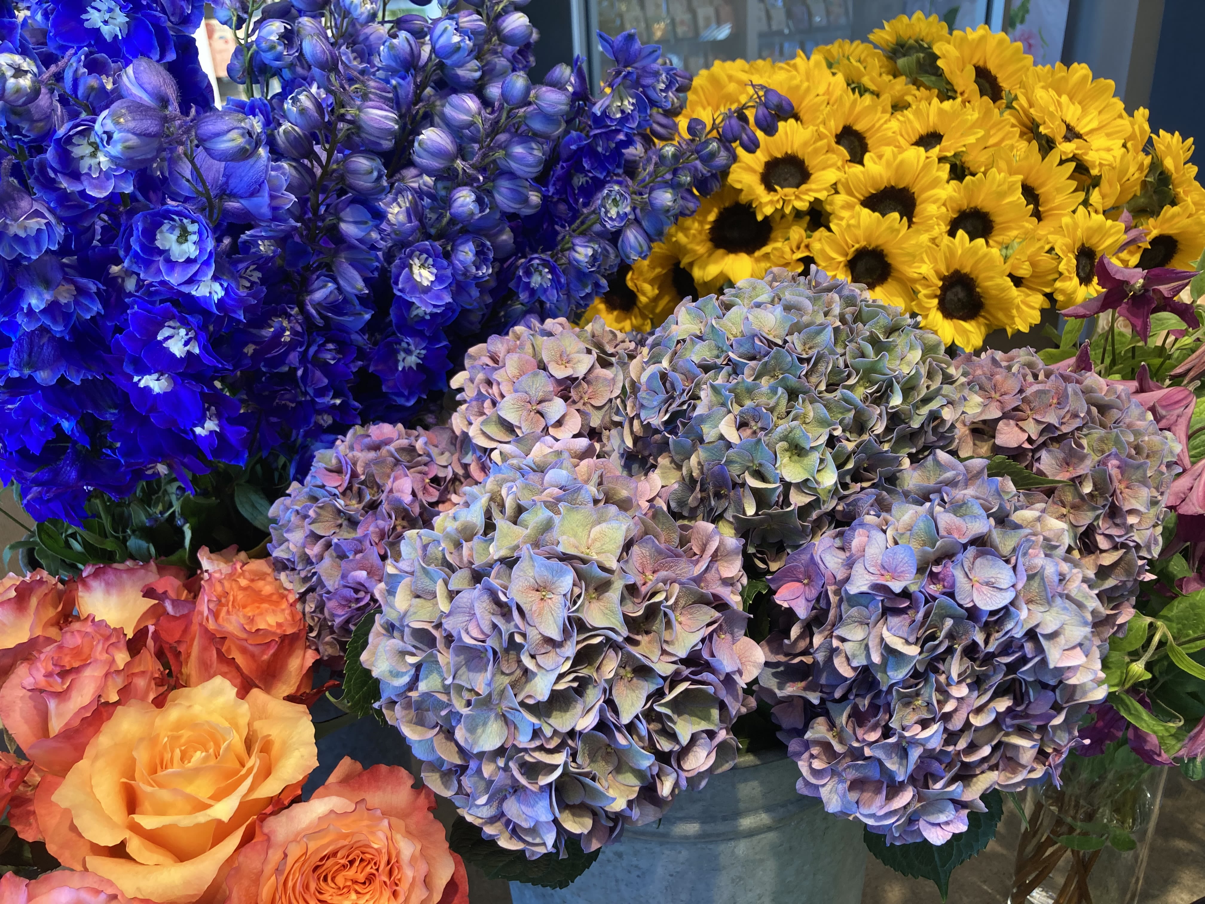 Market Fresh - The freshest flowers and greens of the season are artfully arranged by our designers and delivered in a vase suitable for the blooms. 