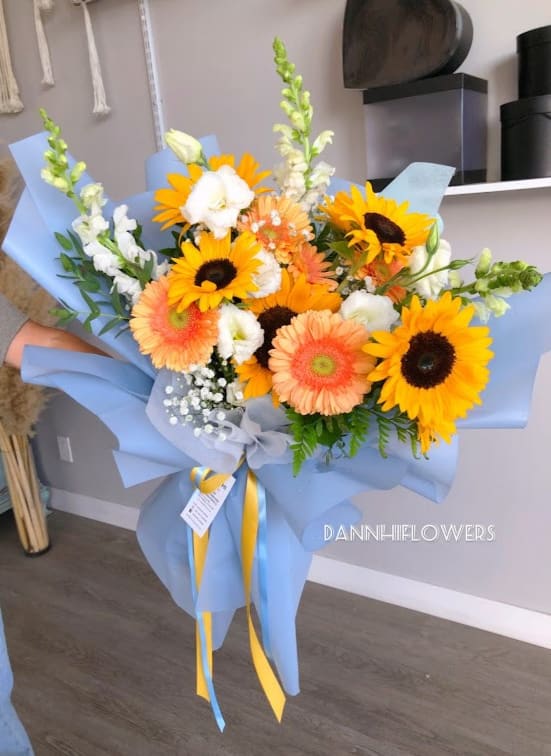 Congratulations bouquet 01 - Mix flowers bouquet of sunflowers, gerbera daisy and lisianthus, wrap with light blue water proof paper wrap. You can request a different paper color for wrapping on the special instruction.