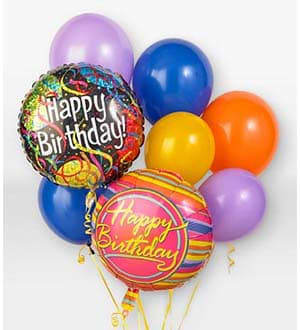 Birthday balloons in purple, blue, yellow, orange, and pink