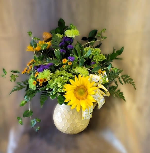Bee Pretty Pitcher - Bright garden-style mix with a sunflower focal, green &amp; purple blooms in a yellow ceramic pitcher with bow
