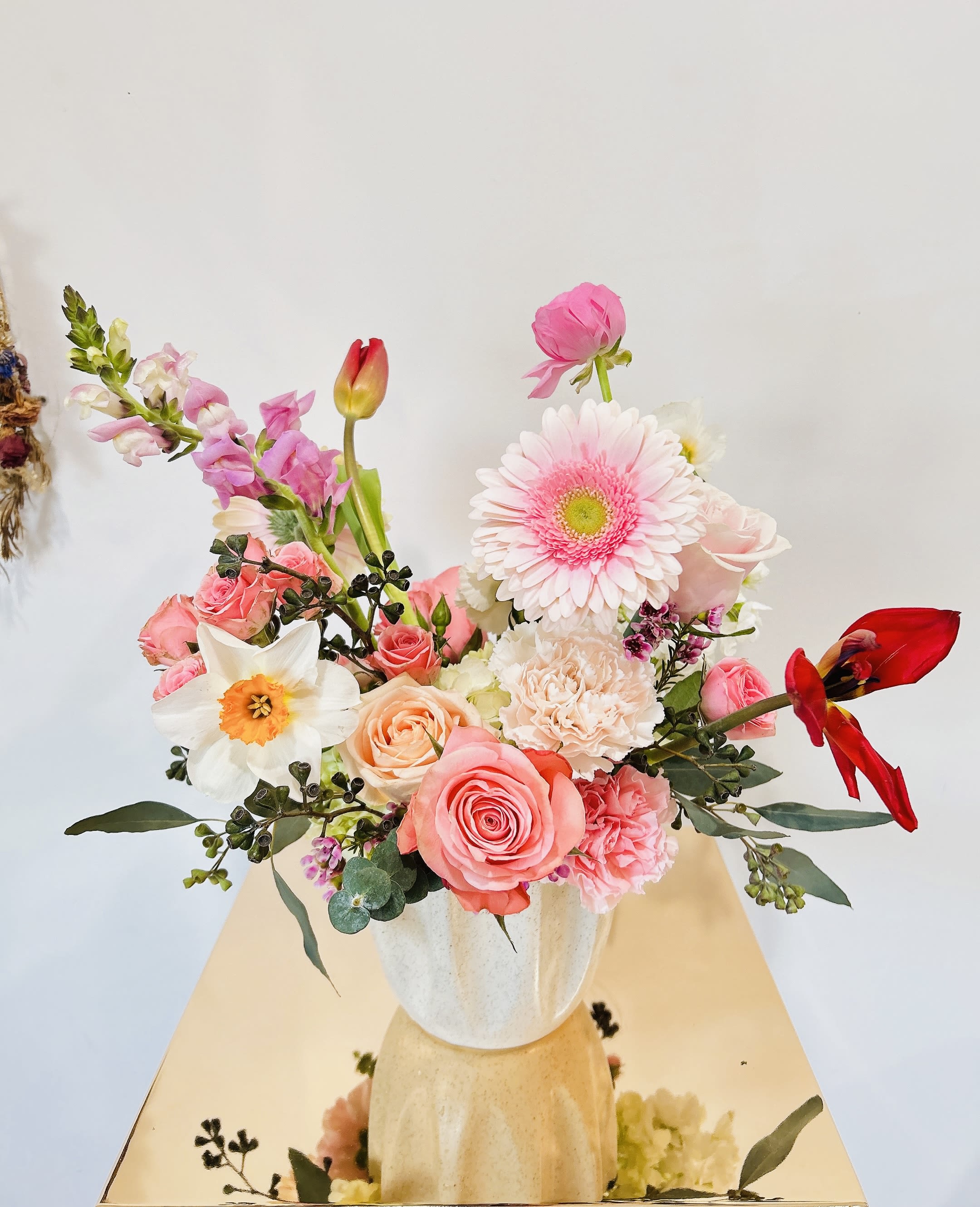 Pink and white mixed bouquet in a white vase