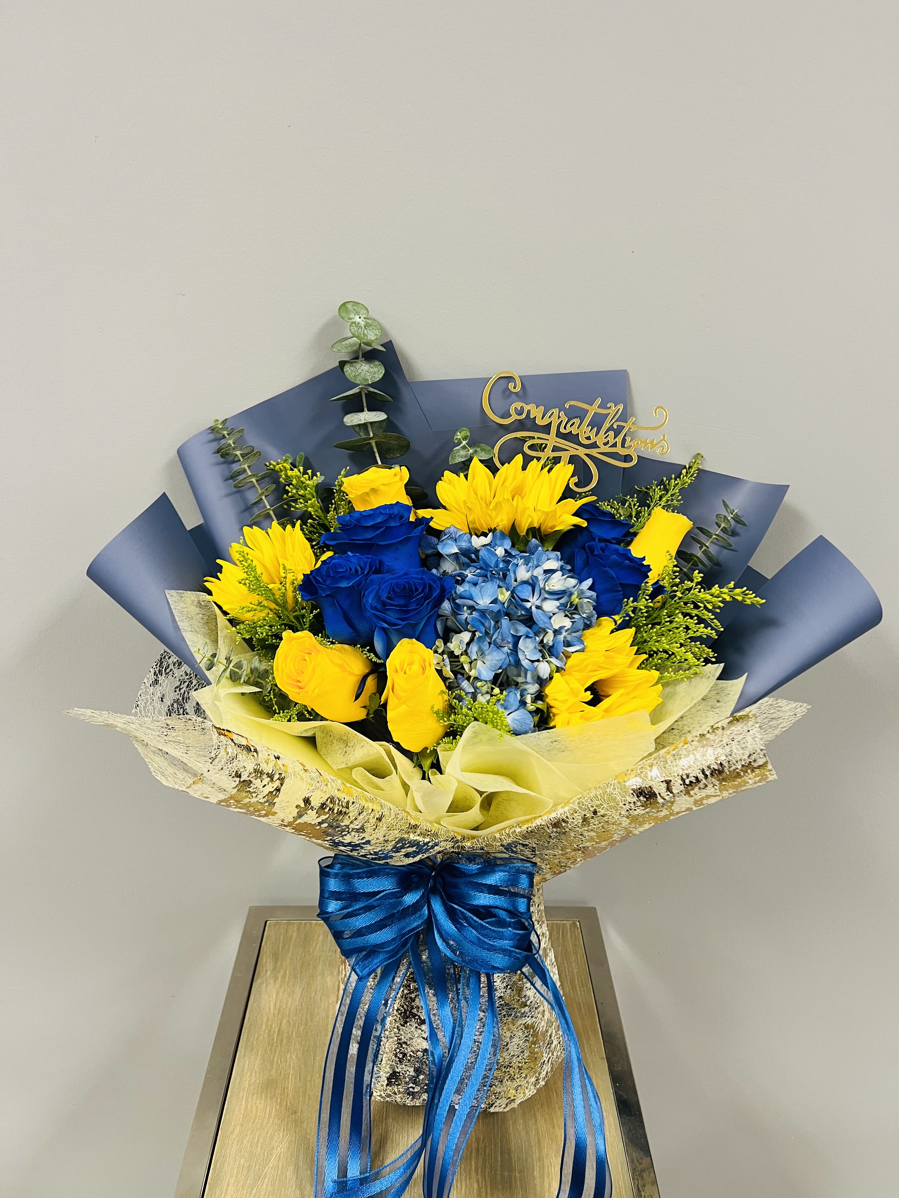 Congratulations bouquet  - Bright sunflowers, blue hydrangeas, yellow &amp; sapphire roses,Congratulations decoration. We can change any color that you like! No need to unpack the package  or any maintenance.Comes with floral foam gives flowers all the nutrition and moisture it needs.