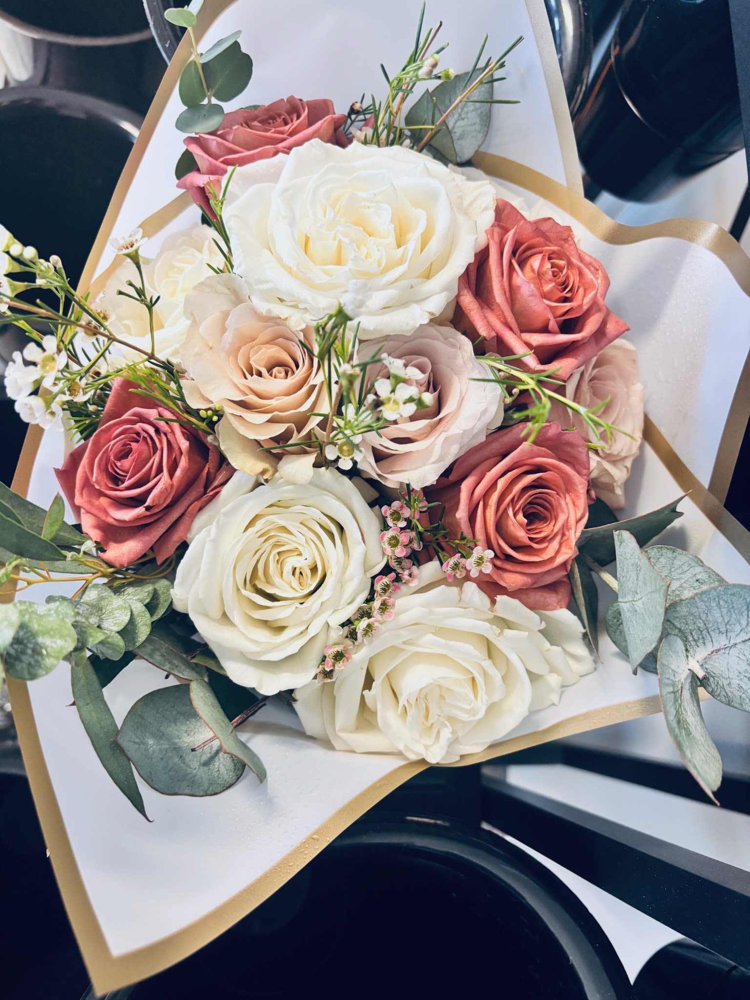 Petite Sunshine Wrap - A petite hand-wrapped bouquet designed for everyday moments, thoughtful gestures, birthdays, thank you gifts, or just because. Featuring a seasonal mix of fresh blooms and greenery, each bouquet is thoughtfully arranged in our signature boutique style and wrapped for a clean, modern presentation.
