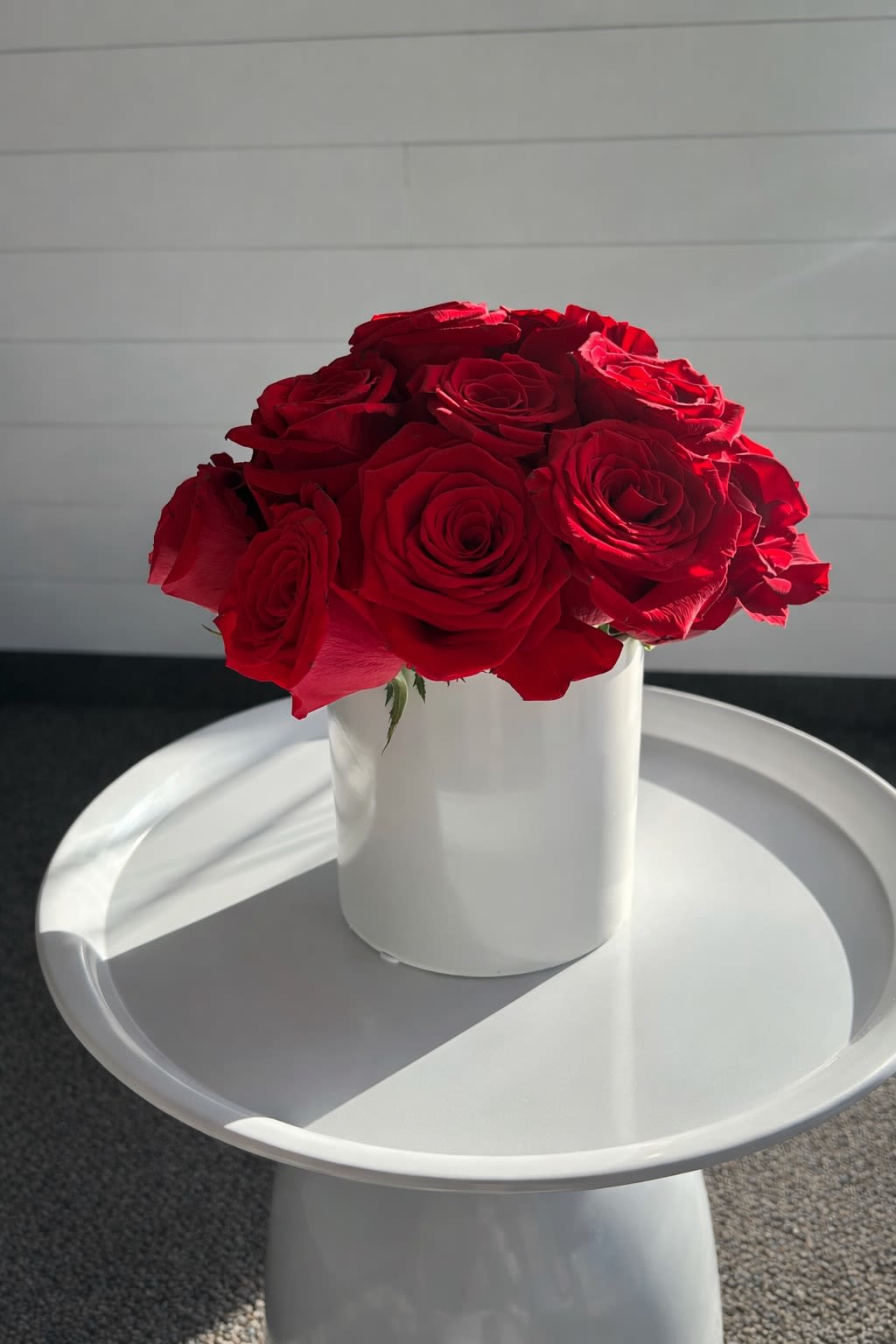 Rays of Roses - An abundant rose arrangement designed with lush, premium roses and seasonal greenery in our signature boutique style. Our Rays of Roses collection is thoughtfully crafted in our Hilliard studio and available in Standard, Deluxe, and Premium sizes, each presented in either a clear glass or ceramic vase.  Perfect for anniversaries, birthdays, celebrations, romantic gestures, sympathy, or making a lasting impression.  Each arrangement is uniquely designed using the freshest available roses... colors and bloom varieties may vary while maintaining the overall luxurious style.  Local flower delivery and pickup available from A Ray of Sunshine Floral  in Hilliard, Ohio.