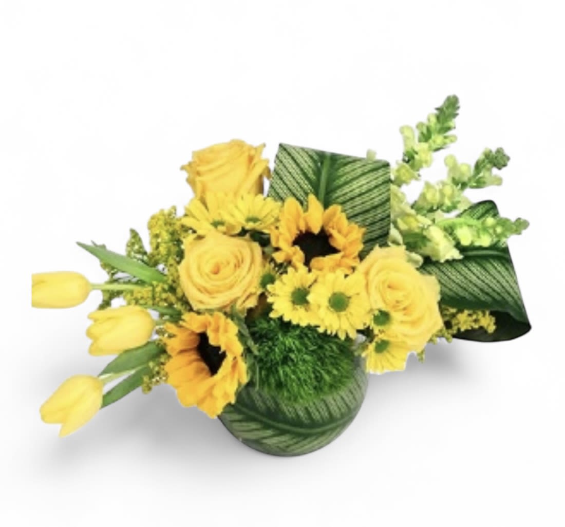 Yellow flowers arranged in a green patterned vase