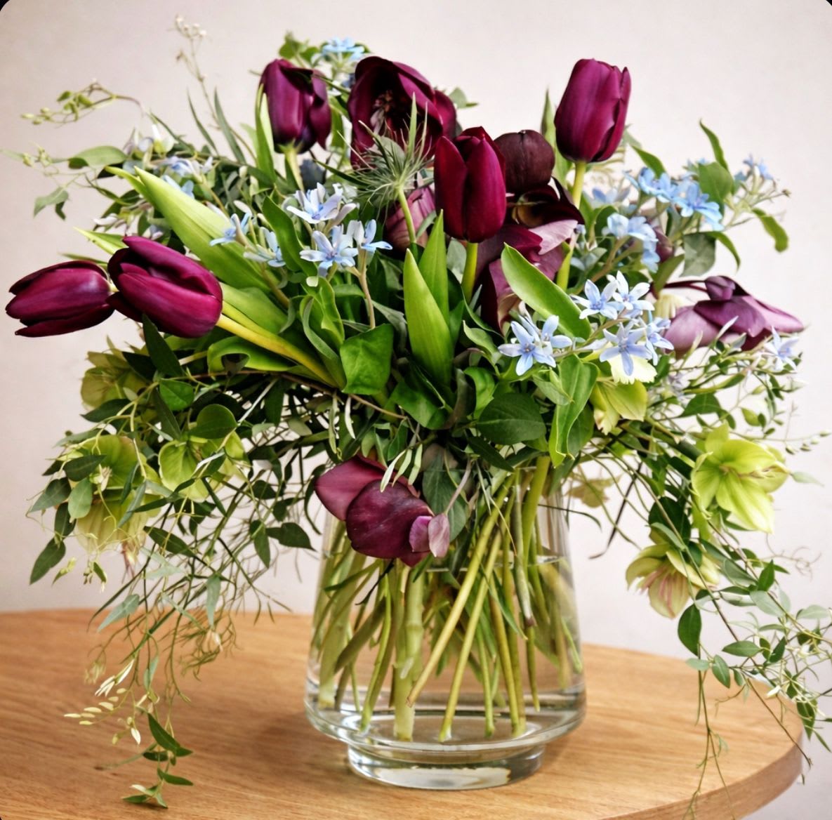 Whirlwind - Whirlwind is a loose, garden-inspired arrangement that captures a sense of effortless movement and natural beauty. Designed with a thoughtful mix of seasonal blooms and airy greenery, this piece features an organic, asymmetrical shape that feels fresh and modern. Light in structure yet rich in texture, Whirlwind brings a relaxed elegance to any setting. 
