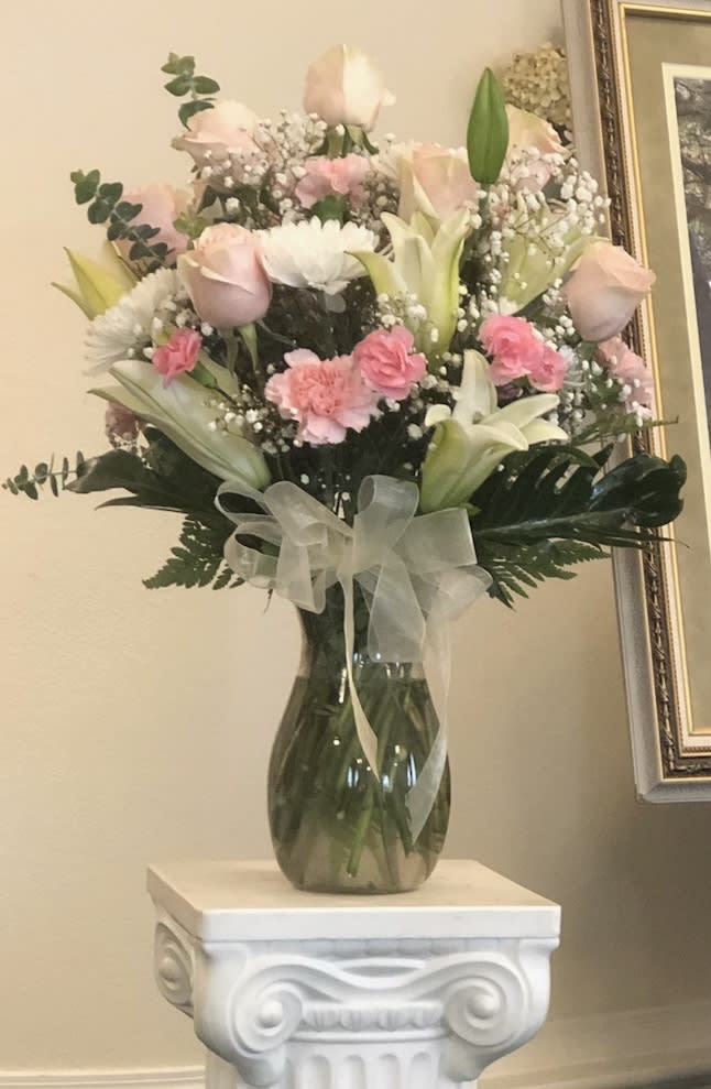 Delicate Touch - This bouquet has pink roses, lilies, and eucalyptus for that nice delicate touch