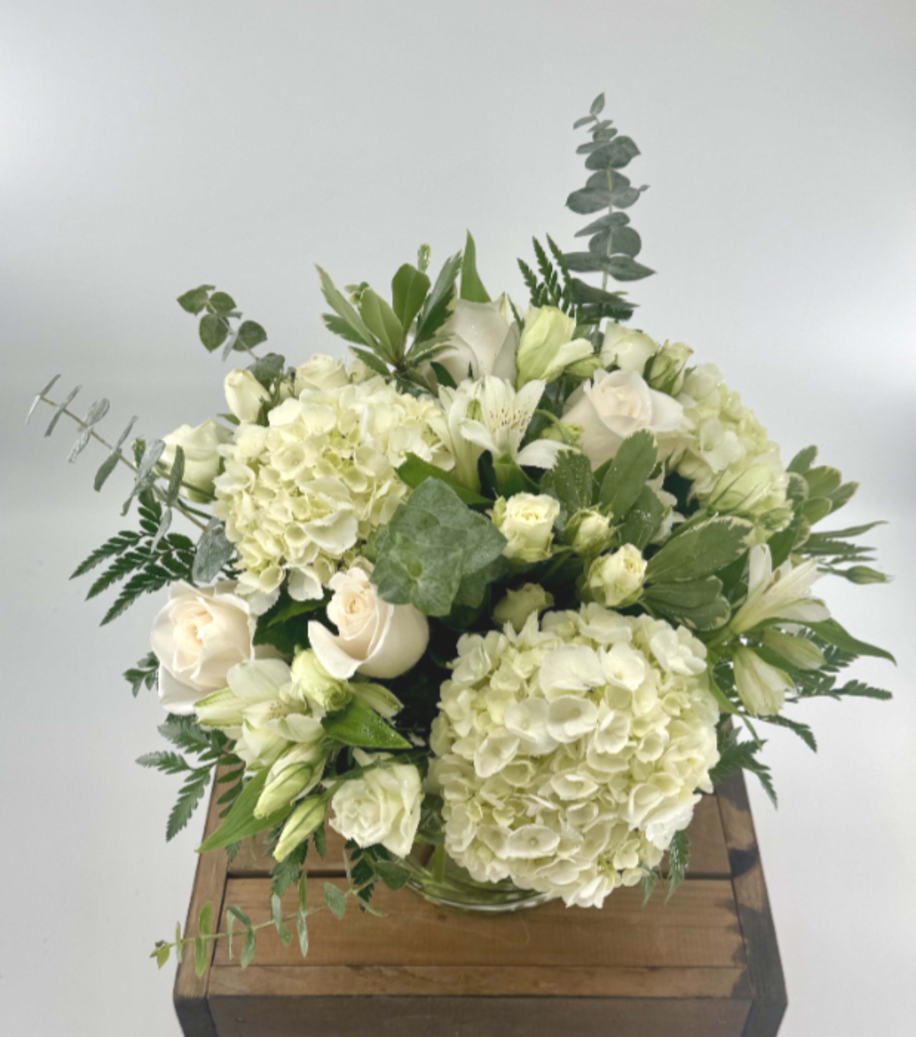 Cloud Nine (BB) - New beginnings deserve flowers! This all white arrangement includes roses, lisianthus and hydrangeas. Cloud Nine is the perfect gift for celebrating a new year, a new baby, or a newly married couple.