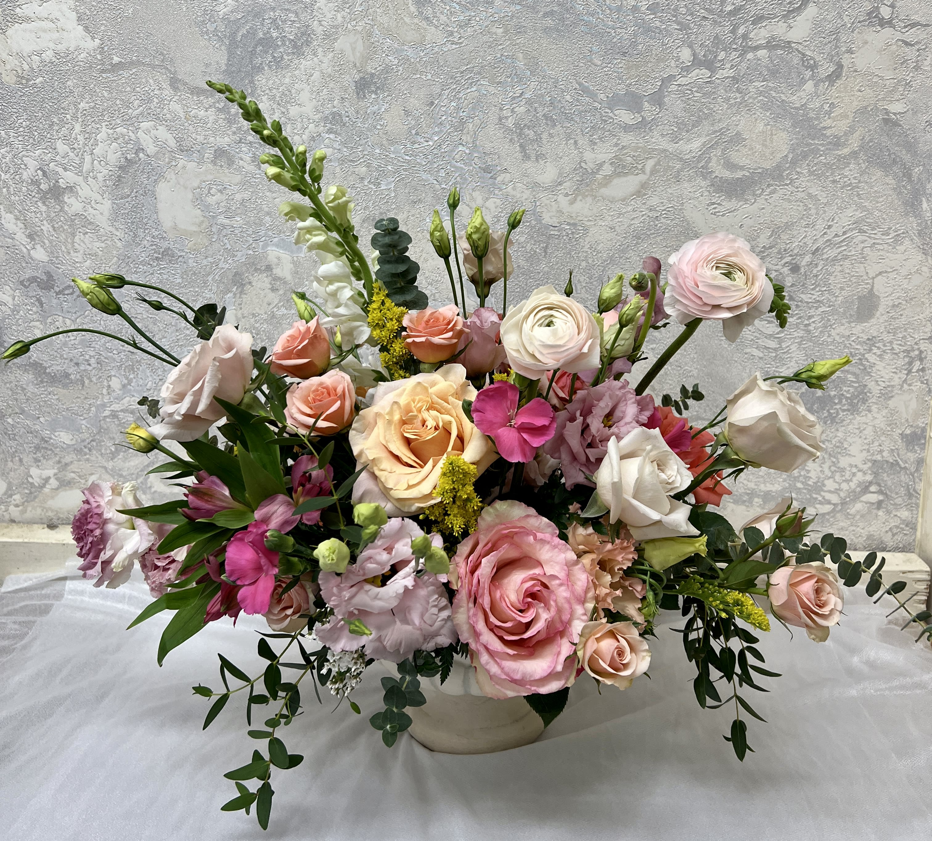 Victoria's Garden - A sublime mix of garden flowers in shades of white, pink, peach and lavender.  Hydrangea, snapdragons, roses, stock and lisianthus in a clear cylinder vase.  
