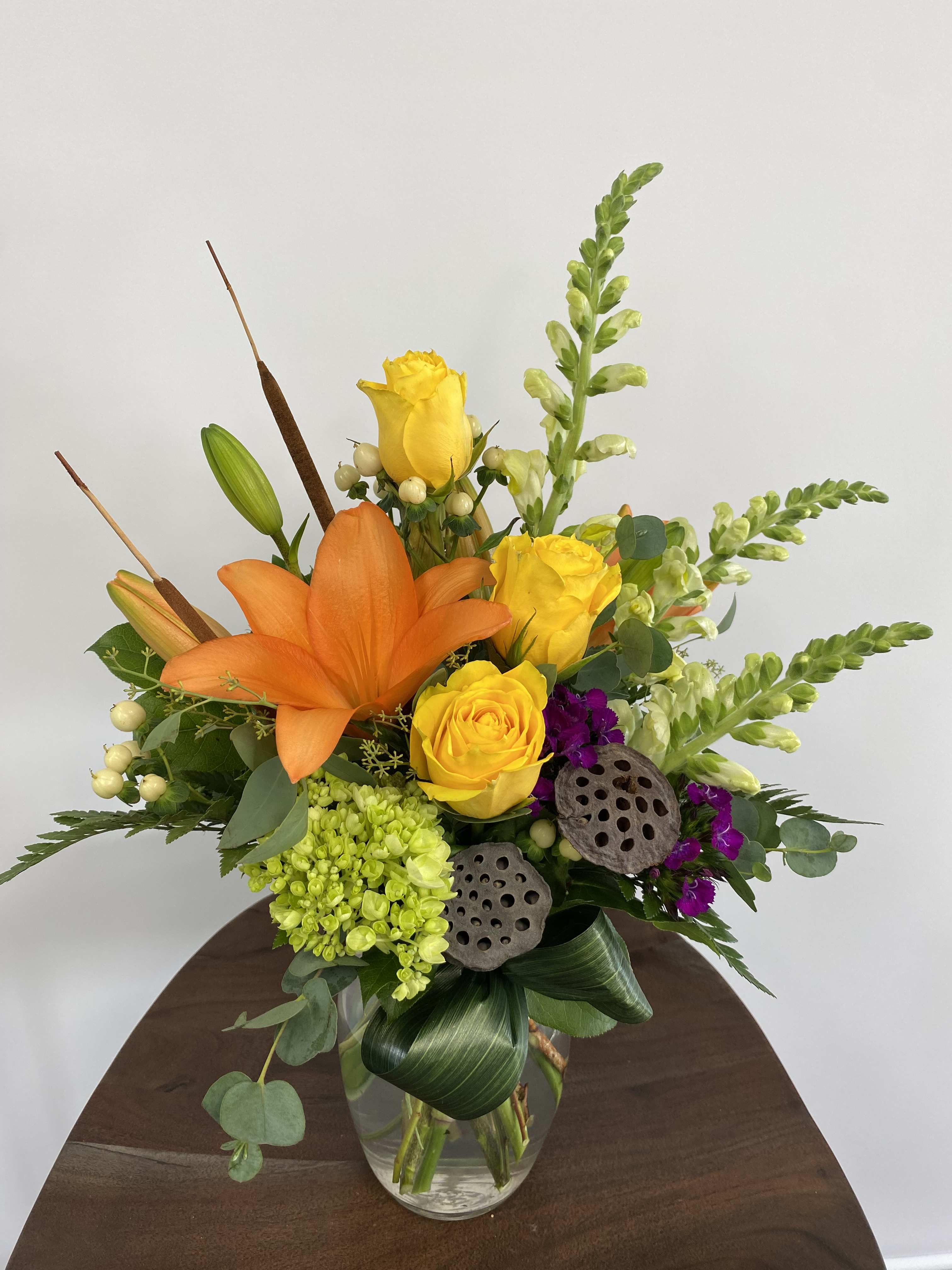 Natural Beauty  - Bright colors and natural elements pair together perfectly in this bold arrangement. 