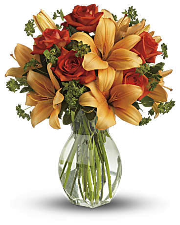 Fiery Lily and Rose - Spark someone's attention by sending this absolutely radiant bouquet. Full of flowers and fiery beauty, it makes a beautiful gift for any occasion.  Features dark orange roses and orange asiatic lilies in a charming glass vase. It's fiery and it's fabulous!  Approximately 15" W x 18" H