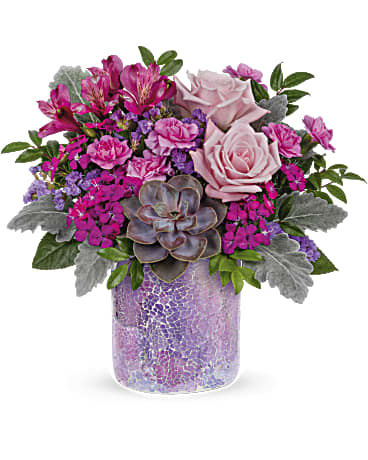 Lovely Shine Bouquet - As magical as sunset in the desert. Luscious pink roses and a sculptural succulent get the glamorous treatment in a shimmering mosaic glass vase.  This chic bouquet features light pink roses, purple alstroemeria, miniature lavender carnations, dark pink sweet william, lavender sinuata statice, dusty miller, huckleberry and a large green echeveria succulent plant. Delivered in a Shining Beauty cylinder.  SUBSTITUTION POLICY – Always deliver the freshest flowers! Please note the bouquet pictured reflects our original design.  If the exact flowers or container in this arrangement are not available, we will create a beautiful bouquet with the freshest available flowers.