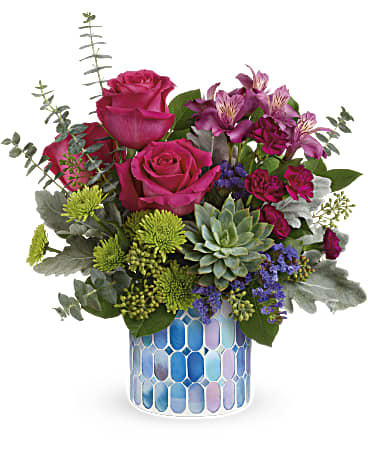 Watercolor Blooms Bouquet - DESCRIPTION VASE SIZES Presented in a shimmering mosaic vase of blue stained glass, this cheerful rose bouquet is a special surprise they'll never forget! Dark pink roses, dark pink alstroemeria, miniature purple carnations, green button spray chrysanthemums and blue sinuata statice are arranged with dusty miller, spiral eucalyptus, seeded eucalyptus and lemon leaf. Delivered in a Blue Beauty Mosaic vase.  SUBSTITUTION POLICY – Always deliver the freshest flowers! Please note the bouquet pictured reflects our original design.  If the exact flowers or container in this arrangement are not available, we will create a beautiful bouquet with the freshest available flowers.
