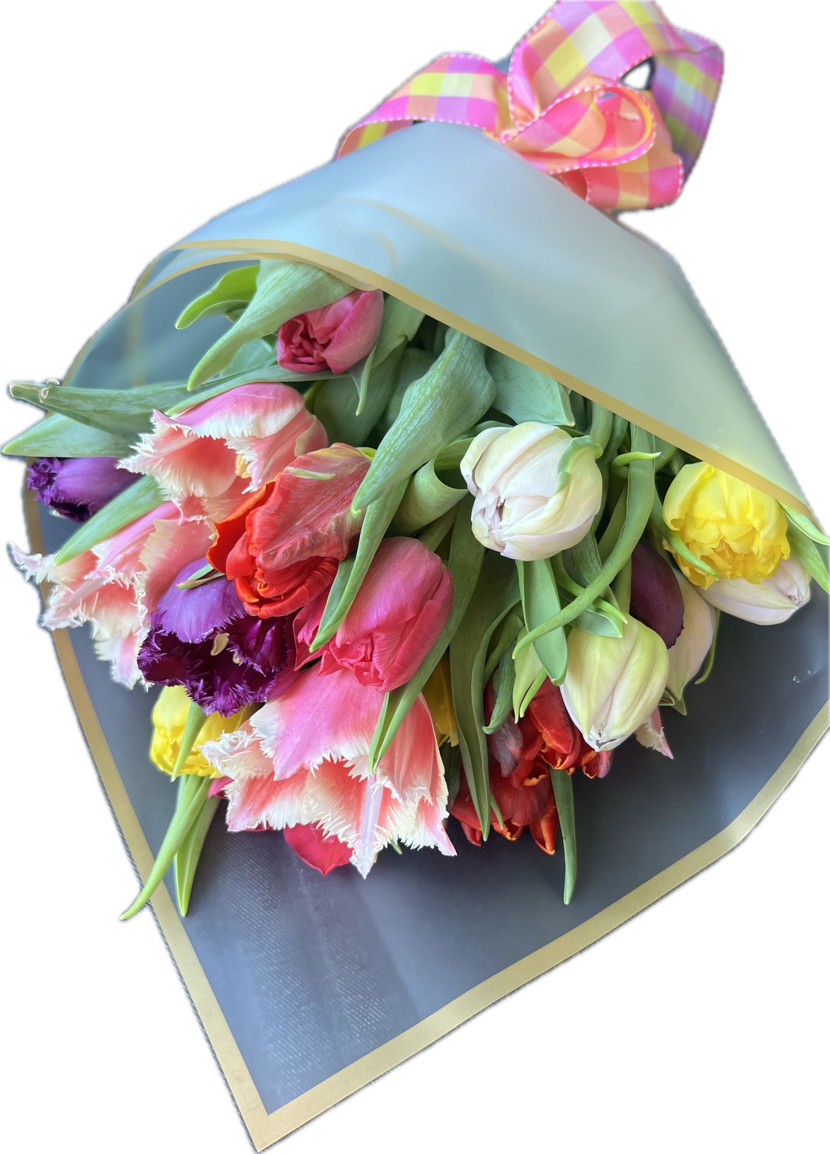 Bouquet of multicolored tulips wrapped in blue paper with a plaid ribbon