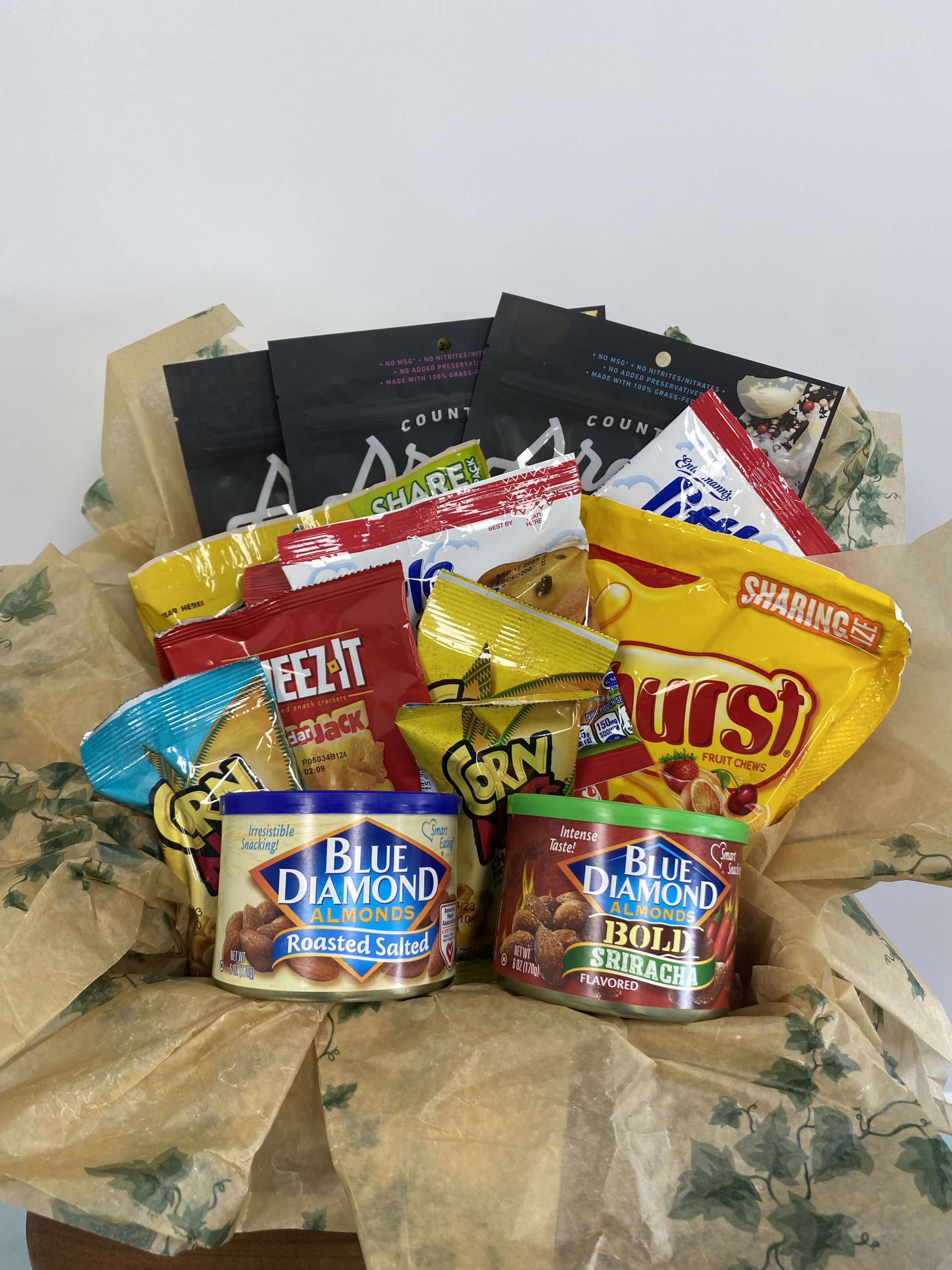Snack Basket - This snack basket has all the goodness. Can be customized to include whatever you want! Please specify any requests. Ie: junk food/gourmet, favorites or dislikes, in special notes. 