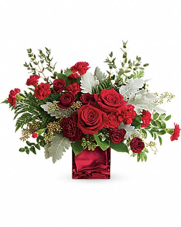 Rich In Love Bouquet - Unforgettable in every sense of the word! Make a dramatic impression with this ultrachic arrangement, featuring a modern organic shape, luxurious blooms, and a shimmering keepsake cube vase.  This dramatic bouquet features red roses, dark red spray roses, maroon carnations, red miniature carnations, dusty miller, leatherleaf fern, huckleberry, seeded eucalyptus, lemon leaf, and parvifolia eucalyptus. Delivered in a Red Mirrored Cube.