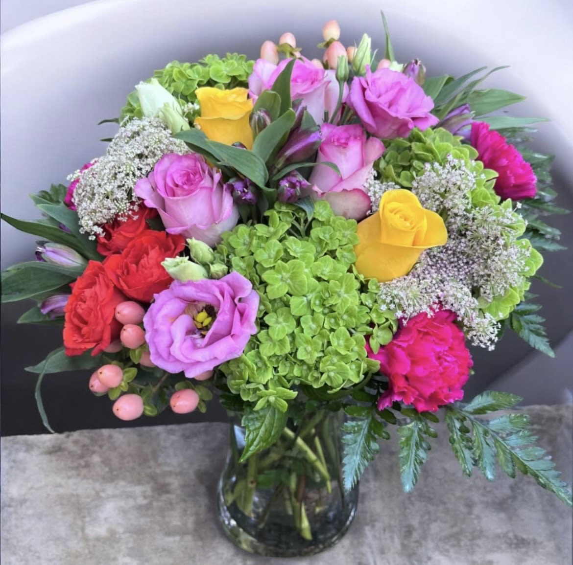 Sweeter Then Ever  - This arrangement has alstroemeria, roses, spray roses, carnations, queen Ann’s lace, lisianthus, hypericum, carnations and greenery.
