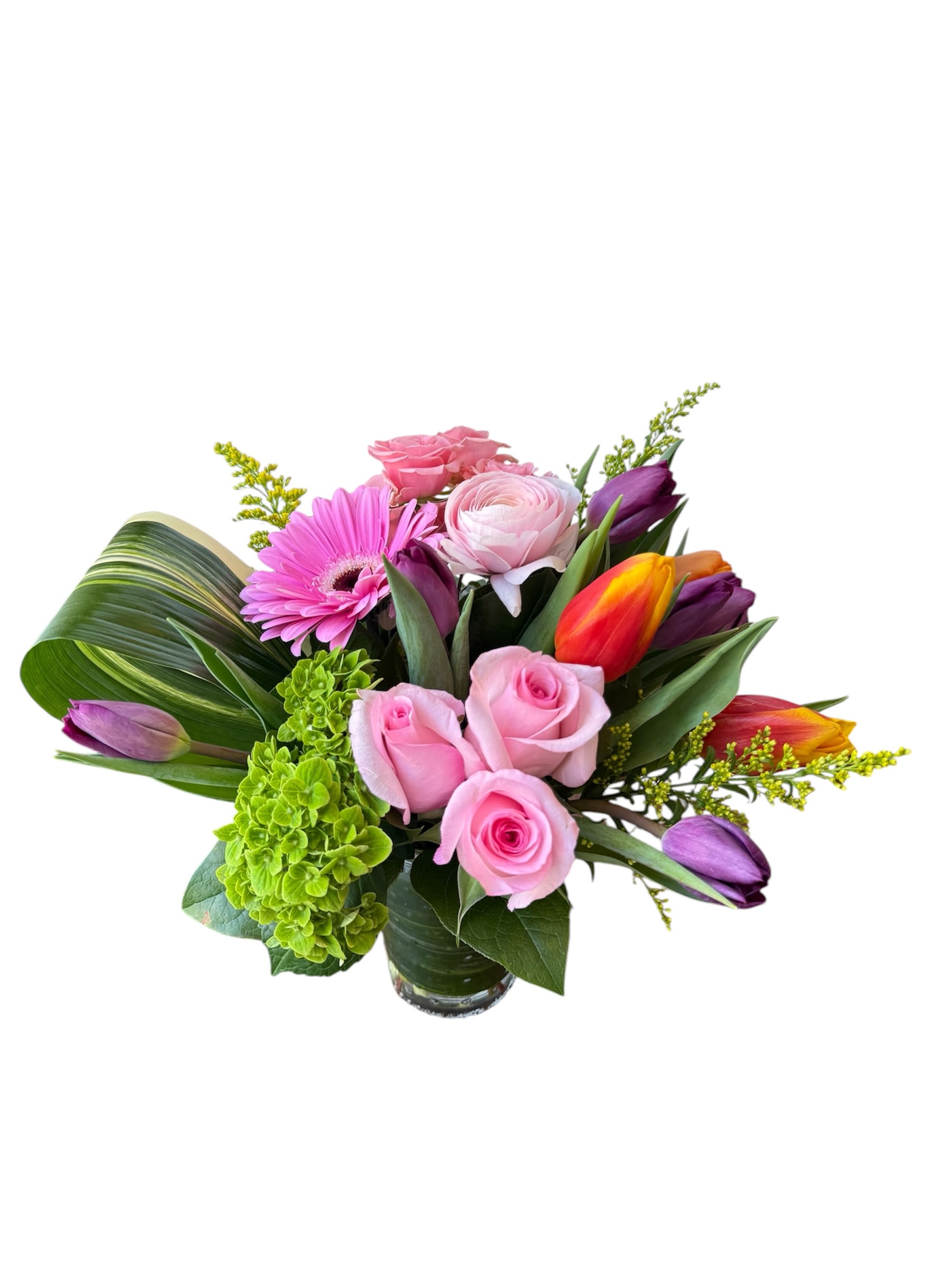 Grace Garden - Pink roses, pink gerbera daisy, green hydrangea, tulips, spray rose and ranunculus designed in a glass vase. 