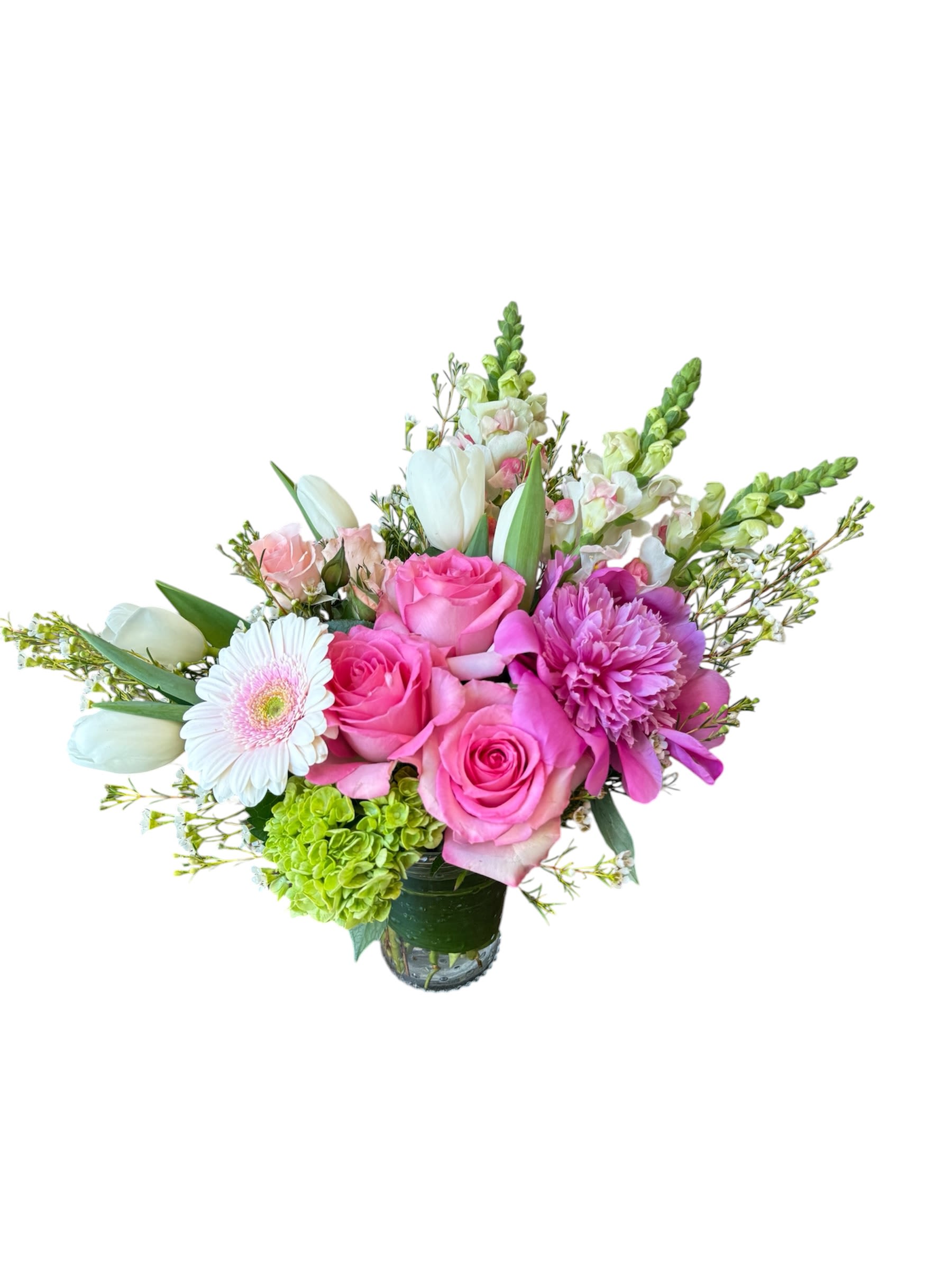 Peoni Petals  - Pink roses, pink peony, snapdragons, spray rose, white tulips, green hydrangea, pink gerbera and white wax flower designed in a glass vase. As shown in photo.