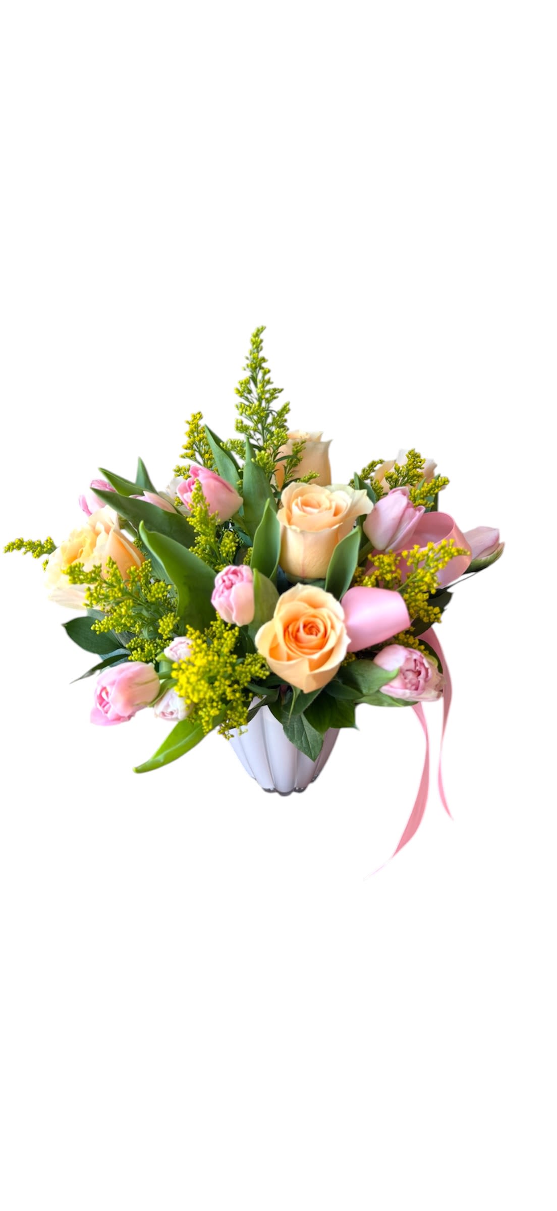 Sweet Meadow - Peach roses, pink tulips and yellow aster designed round faced in a pink glass vase. As shown in photo.