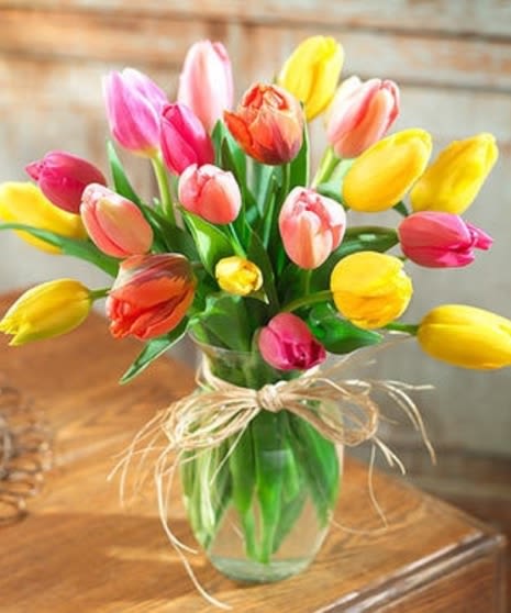 Tenderly Tulips- 20 stems- assorted colors  - Picked fresh from the farm, this tulip Bouquet is a jubilant expression of the changing seasons! Celebrate the day with our finest tulips in a bright assortment of colors, seated in a clear glass vase creating a dazzling bouquet that showers them with your affection. 