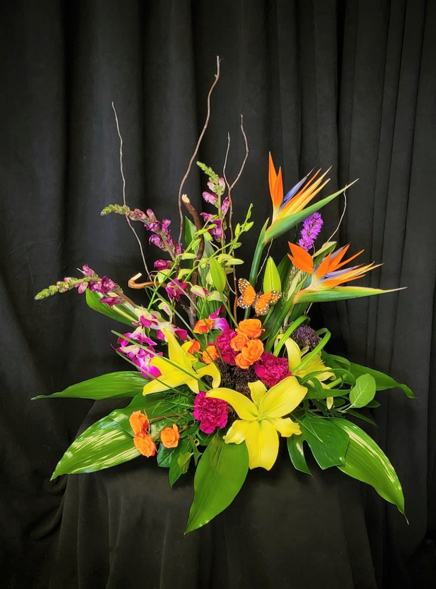 Island Escape - A large tropical arrangement, full of island blooms. Some flowers may vary due to availability.
