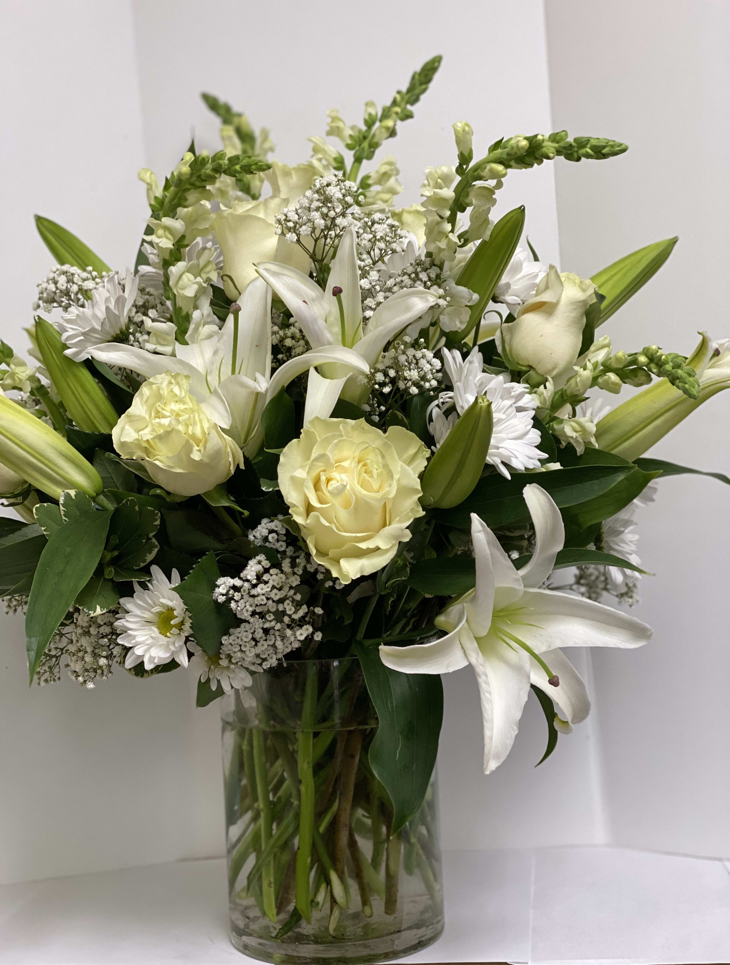 Thinking of You - This monochromatic white arrangement is an elegant display that conveys your thoughts.