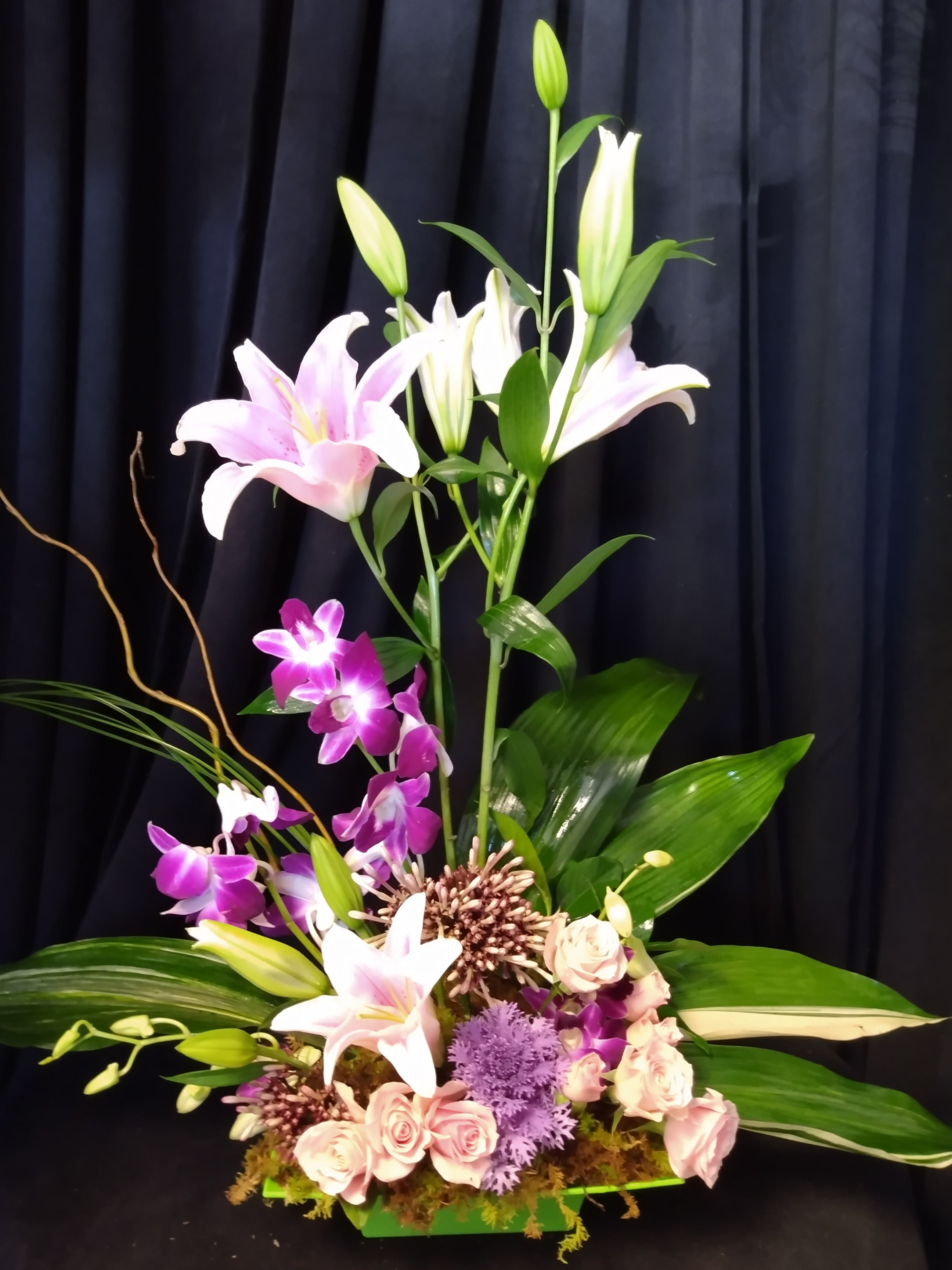 Paradise Found - Lilies and orchids star in this one.