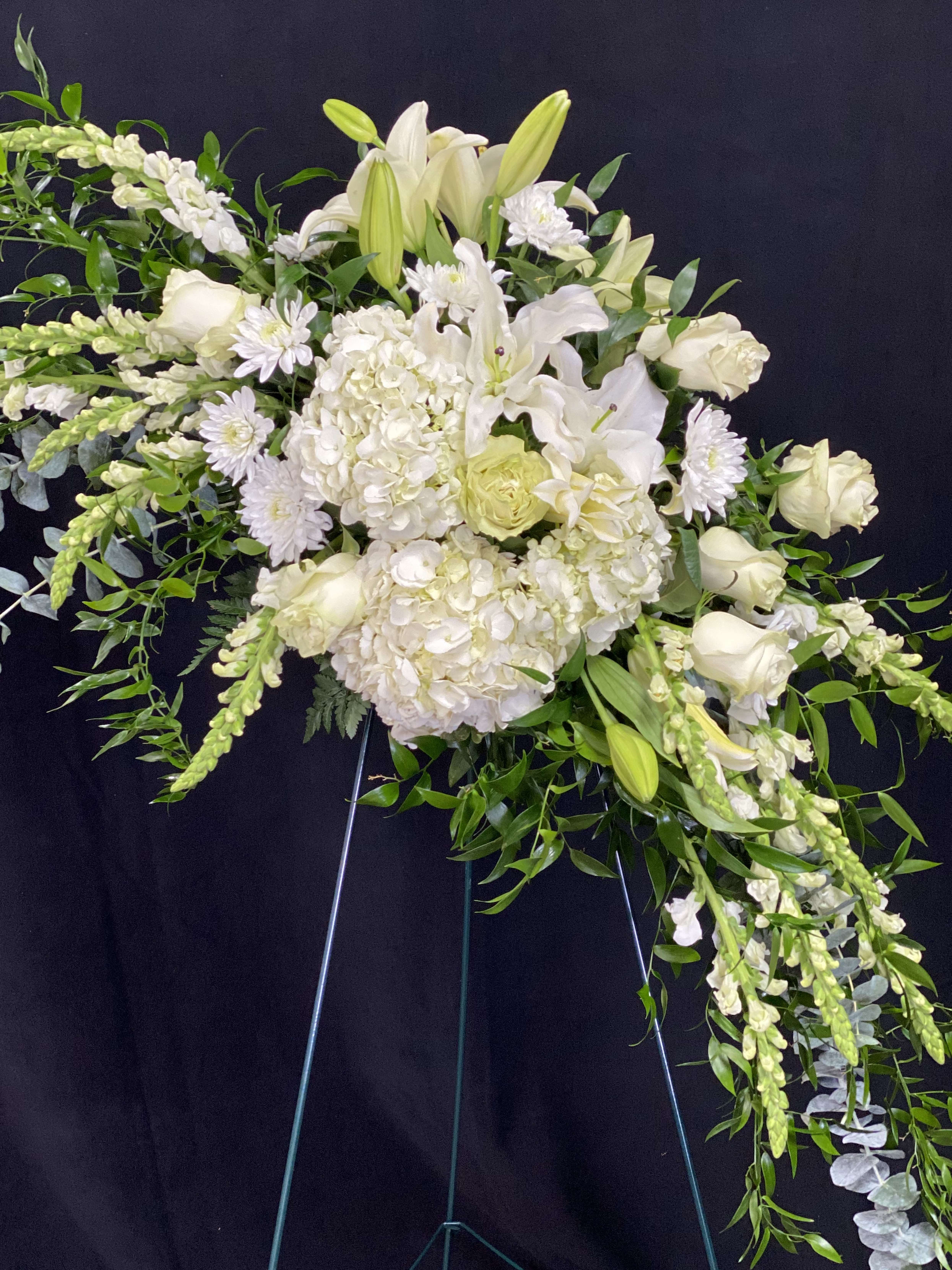 Peaceful Serenity - Peaceful Serenity An elegant expression of sympathy this wondrous white and green standing spray conveys serenity and peace. Places on a 57" stand.
