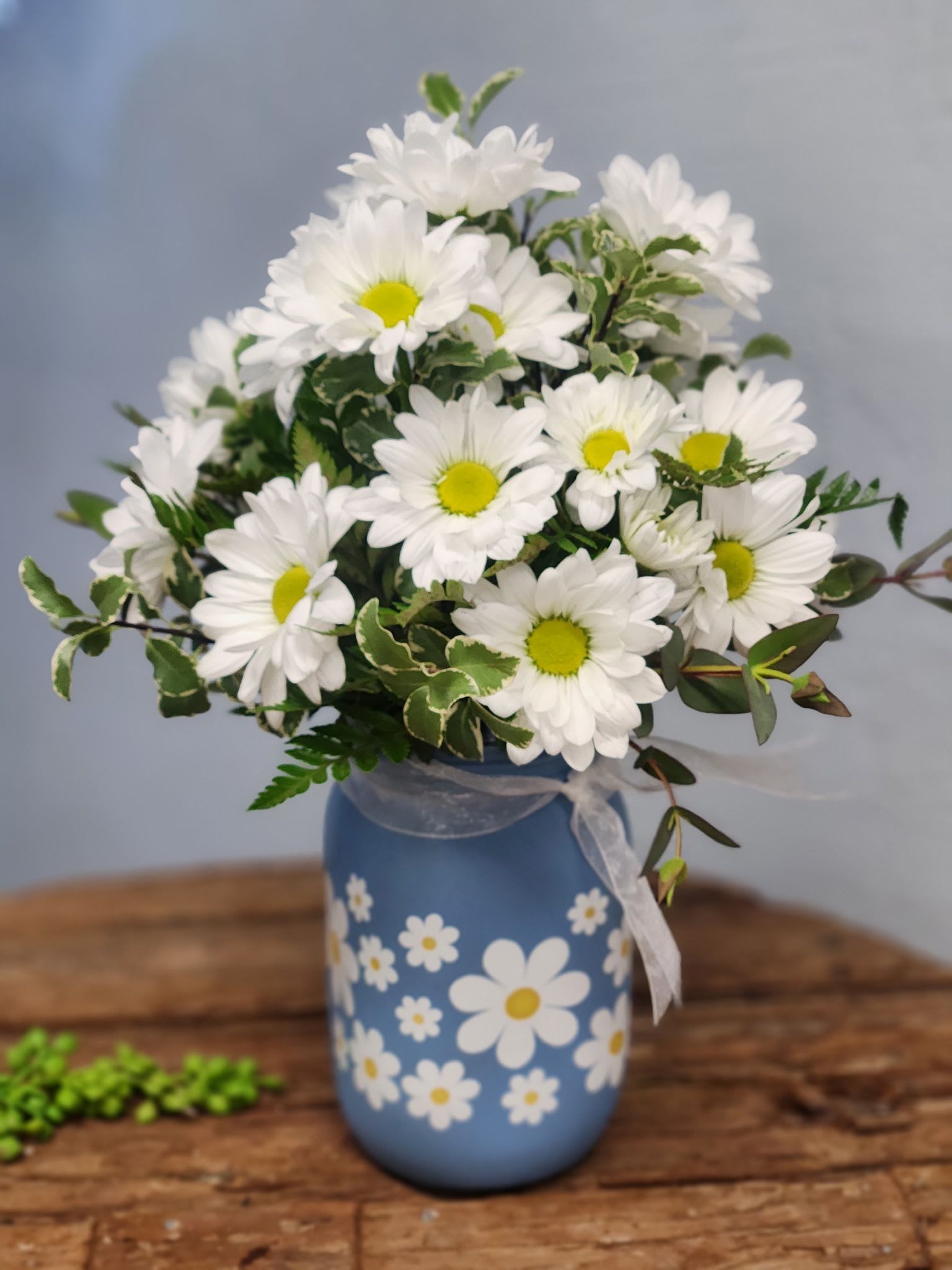 Carol’s Daisies  - Happy white daisies in a cute daisy jar. Simply adorable! 