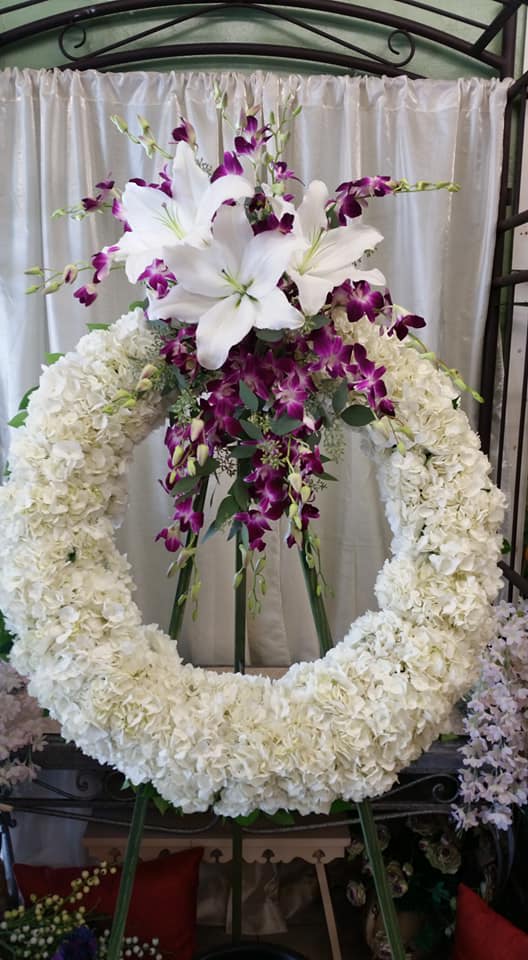 Grateful Memories - Celebrate your loved one with abundant tropical blooms and soft hydrangeas. It's a tribute fitting for someone who brought such love and warmth to the world.
