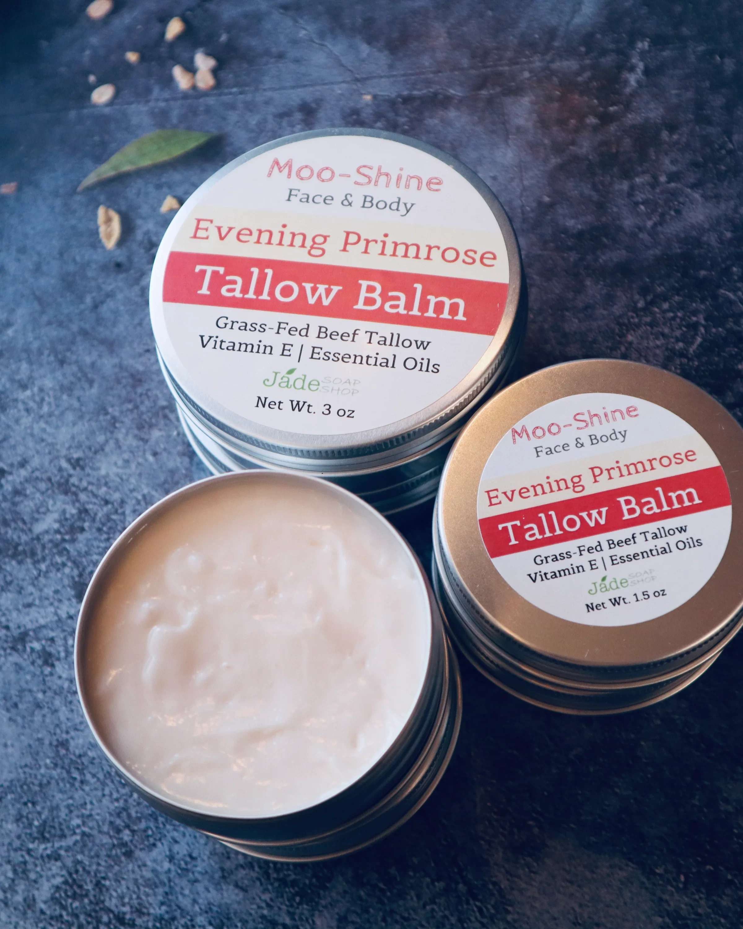 Moo-Shine Evening Primrose Tallow Balm | For Face &amp; Body - Moo-Shine Evening Primrose Tallow Balm | For Face &amp; Body  A rich yet silky balm made with grass-fed beef tallow and evening primrose oil to deeply nourish and soften skin. Shea butter, cocoa butter, and sweet almond oil help lock in moisture, while a gentle blend of marjoram and frankincense essential oils adds a calming finish. Ideal for dry, sensitive, or mature skin.  Ingredients: Grass-Fed Beef Tallow, Shea Butte, Beeswax, Evening Primrose Oil, Sweet Almond Oil. Arrow Root Powder. Vitamin E Oil. Essential Oils of Marjoram, Frankincense.  How to use: Warm a small amount between clean hands and massage into clean, damp skin on face or body. Use daily or as needed. Net Weight: 1.5 oz