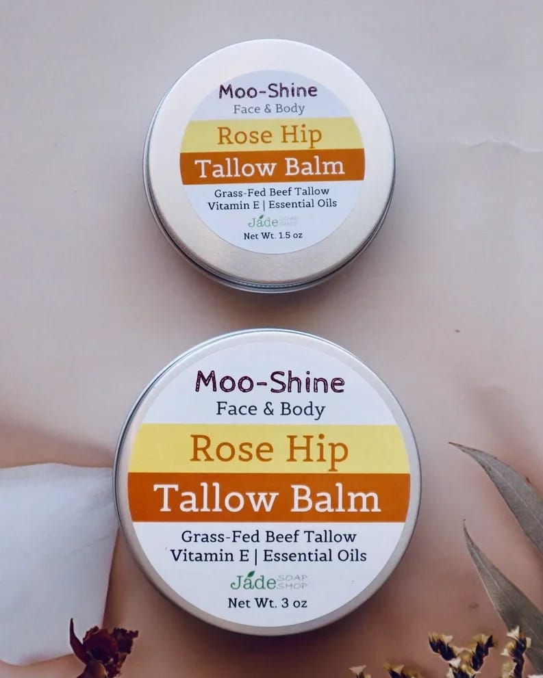 Moo-Shine Rose Hip Tallow Balm | For Face &amp; Body - Moo-Shine Rose Hip Tallow Balm | For Face &amp; Body  A rich, all-natural balm for face and body made with grass-fed beef tallow, rosehip oil, shea butter, and sweet almond oil. Infused with Vitamin E and essential oils of rose, rosewood, and lavender to deeply nourish, calm, and restore dry or sensitive skin.  Ingredients: Grass-Fed Beef Tallow, Shea Butter, Beeswax, Rose hip Oil, Sweet Almond Oil. Vitamin E Oil. Arrow Root Powder. Essential Oils of Rose, Rosewood, Lavender.  How to use: Warm a small amount between clean hands and massage into clean, damp skin on face or body. Use daily or as needed. Net Weight: 1.5 oz