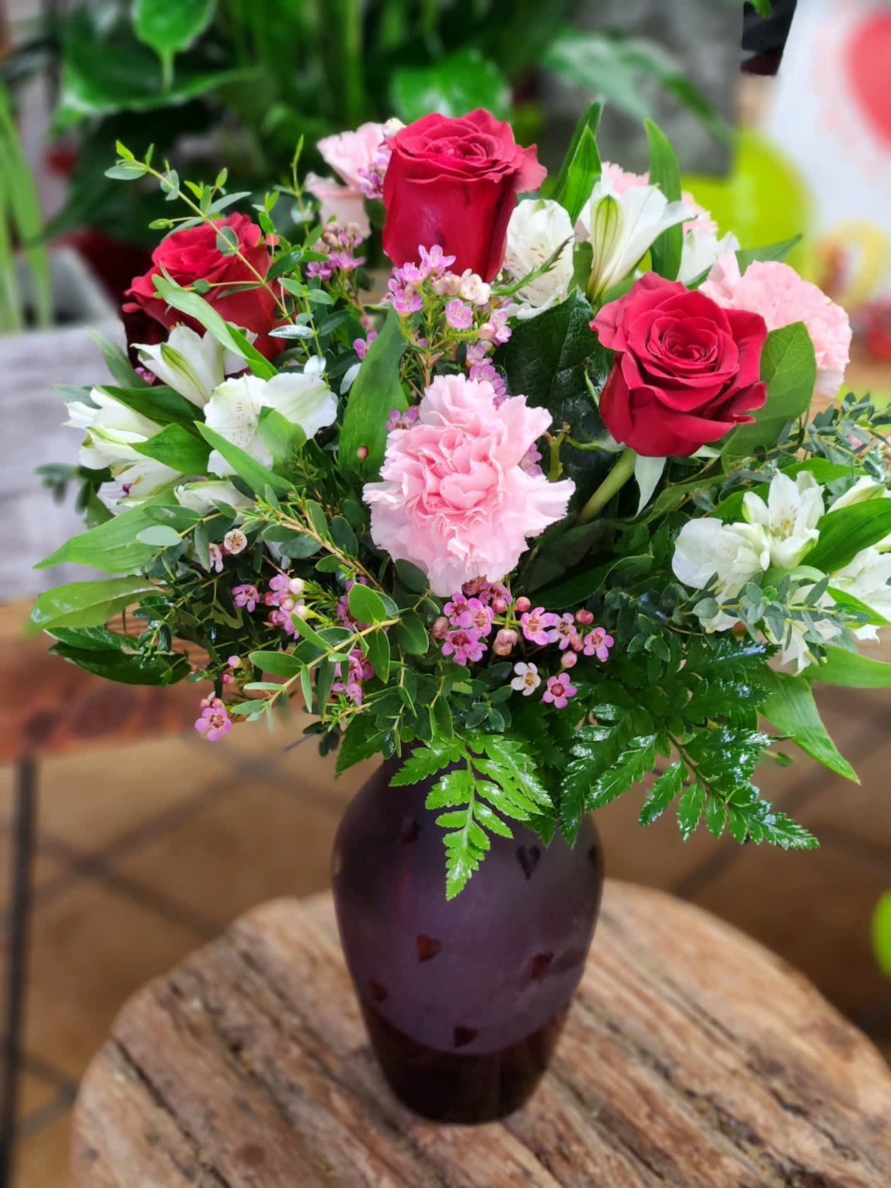 True Hearts Bouquet  - Red roses, pink carnations and fresh white alstromeria come together in a frosted heart vase. Perfect for that sweet Valentine! 