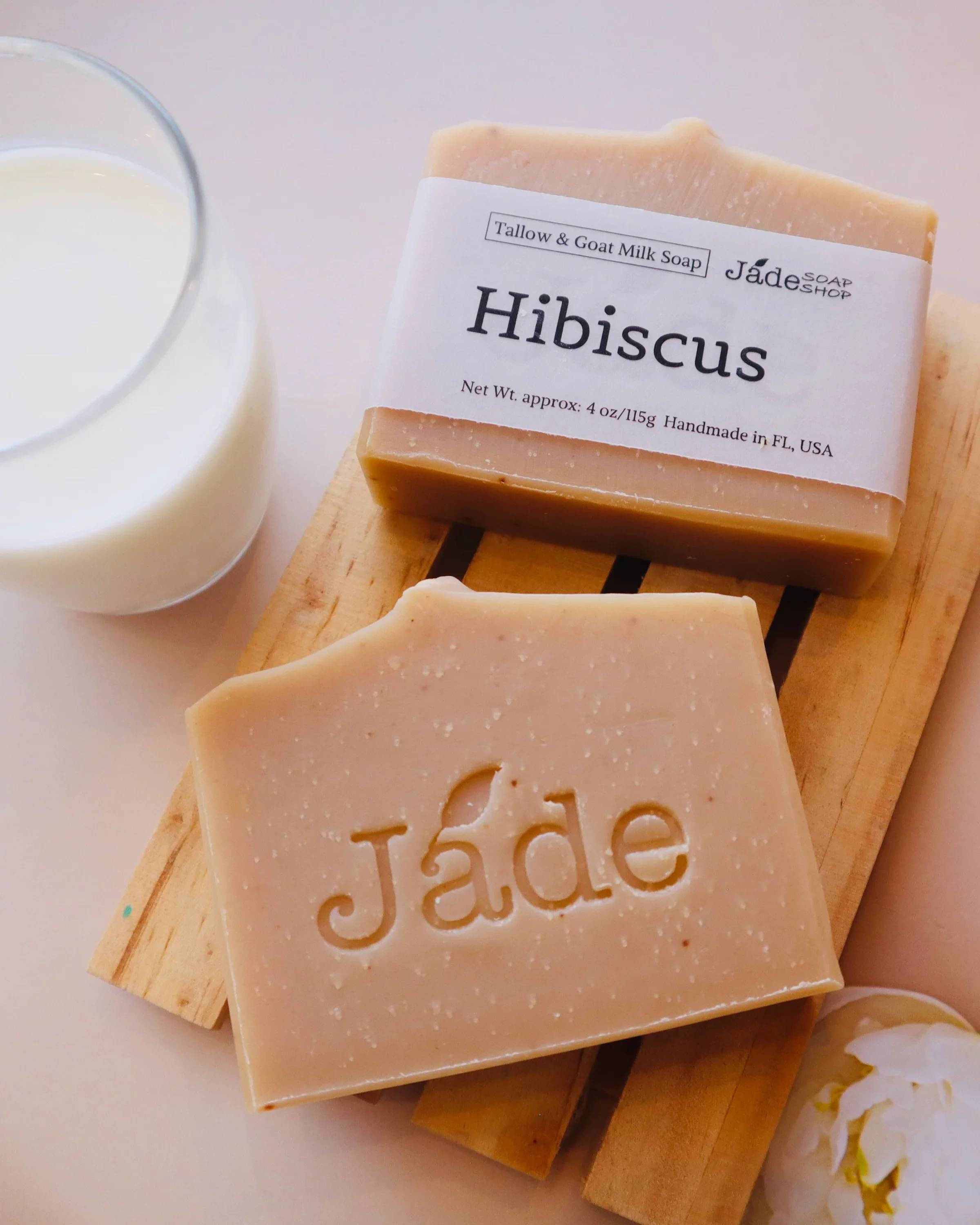 Hibiscus Tallow &amp; Goat Milk Soap - Moo-Shine Tallow Soap | Hibiscus &amp; Goat Milk  Nourish and pamper your skin with this creamy, skin-loving bar made with olive oil, goat milk, and grass-fed beef tallow. Rich in vitamins and antioxidants, it gently cleanses while supporting a healthy glow.   Made with: Saponified Olive Oil, Coconut Oil, Grass-Fed Beef Tallow, RSPO Palm Oil, Sweet Almond Oil. Organic Goat Milk. Hibiscus Powder. Hibiscus Fragrance.  ** Jade Soap Shop uses Sodium hydroxide for saponification. There's no sodium hydroxide exits in the soap after the saponification is done. Sweet Almond Oil contains vitamins A and E, which support skin health by promoting cell turnover, improving elasticity, and providing antioxidant protection against environmental damage. Its mild nature makes it suitable for all skin types, especially for sensitive skin or those with conditions like eczema or psoriasis. It helps calm inflammation and irritation.  Fun Facts of Key Ingredients: Beef tallow, derived from rendered beef fat, offers several potential benefits for skin health and skincare: Soap made with beef tallow, it's ultra-moisturizing, rich in vitamins A, D, E &amp; K, and creates a hard, long-lasting bar with a creamy, stable lather. Great for dry or sensitive skin. Use For: Body Wash. Weight: Full Size Bar approx. 4 oz 