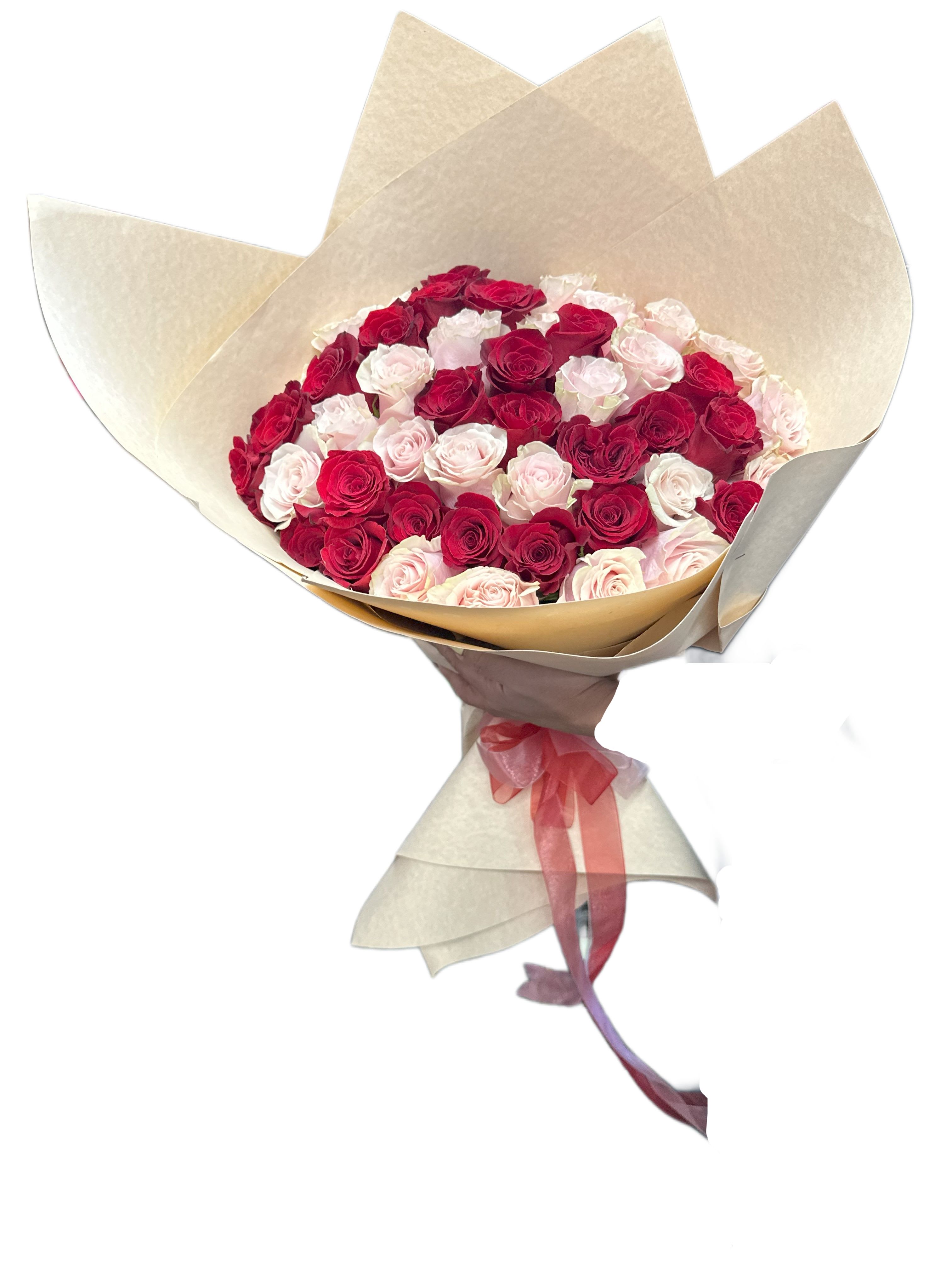 Bouquet of red and pale pink roses wrapped in beige paper