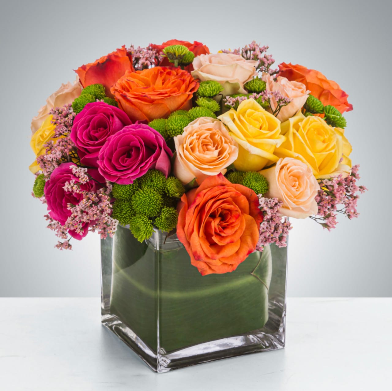 Kaleidoscope  - A full-color explosion, Kaleidoscope is a beautiful gift for anybody you want to impress. Mother-in-law, your boss, a client, etc... this arrangement is a crowd pleaser and an eye-catcher.  Approximate Dimensions: 14"D x 14"H