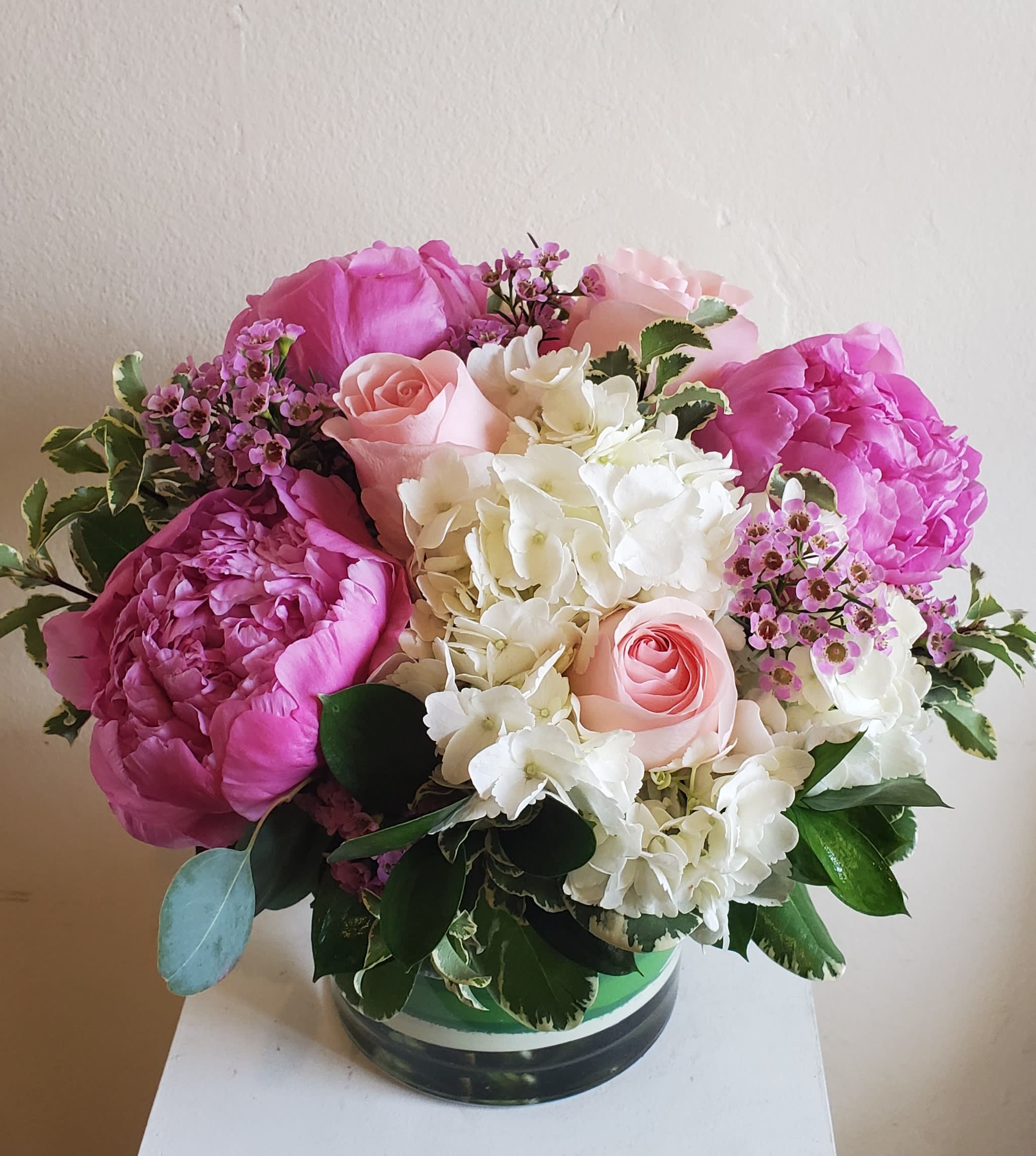 Peonies! - Everyone loves Peonies, White Hydrangea, and Roses.  Peony color might vary.