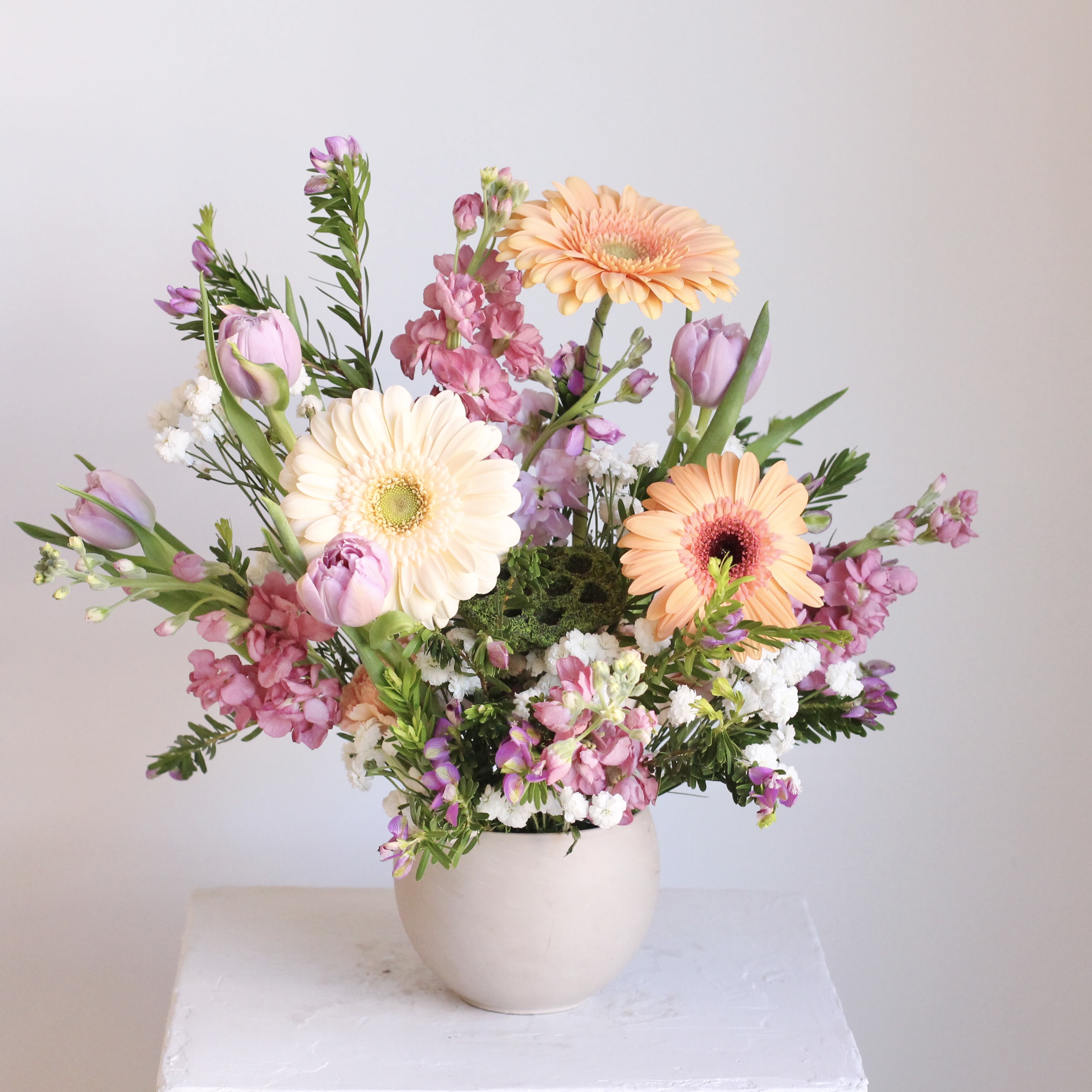 Spring Awakening  - Enjoy a sophisticated arrangement in dreamy shades of mauve, taupe, and peach, designed to exude warmth and effortless elegance. A beautiful way to brighten any space or show someone you care.  Delivery Policy: At Middlemist, we aim to make every delivery seamless and delightful. It is the sender’s responsibility to ensure the recipient is available to accept delivery between 3–5pm on the scheduled date and that the delivery address is accurate. We will send a text notification to the recipient on the day of delivery. If no one is available to receive the order, it will be returned to the shop and may be picked up or redelivered for an additional delivery fee. If a recipient requests the order be left unattended, we cannot guarantee the condition of the flowers or plants, and no refunds will be issued once an order is left outside.
