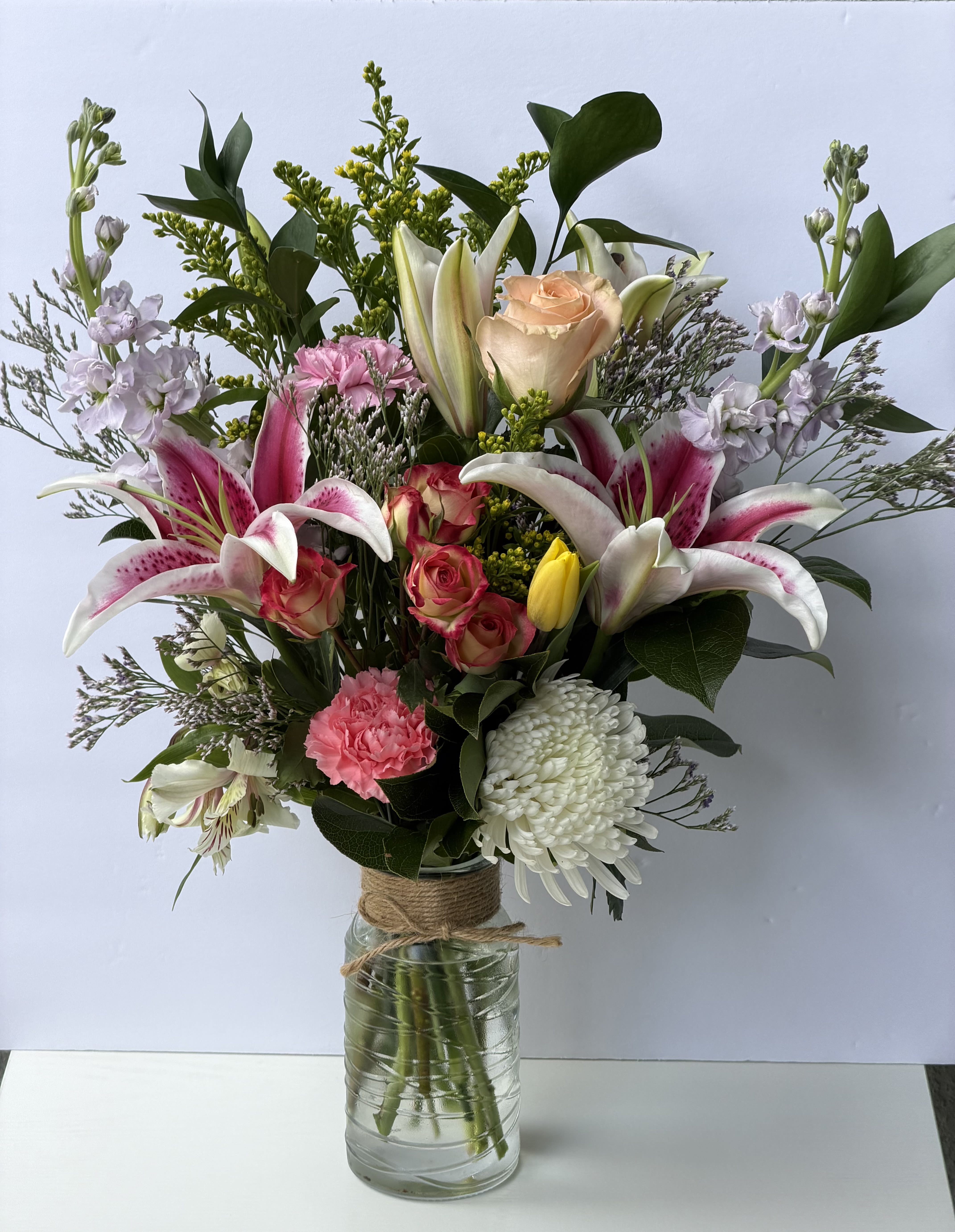 Blush Garden  -  Ideal for moms, friends, or anyone who appreciates soft, romantic colors, this bouquet is tall enough to make a statement on a dining table or entry console. Care is simple: keep stems in clean water, recut ends every few days, and place away from direct heat to prolong blooms - a thoughtful, lasting way to make someone feel truly seen.