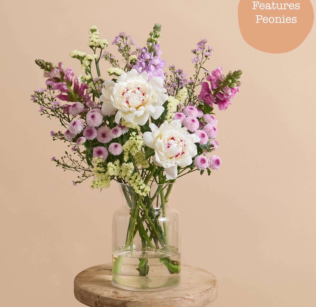 Lilac Sherbet  arangement  - A flavourful combination of shades, this arrangement pairs lilac stocks with snapdragons, light pink asters, and spray chrysanthemums. Zesty lemon statice and dollops of buttery white peonies add texture and fullness.