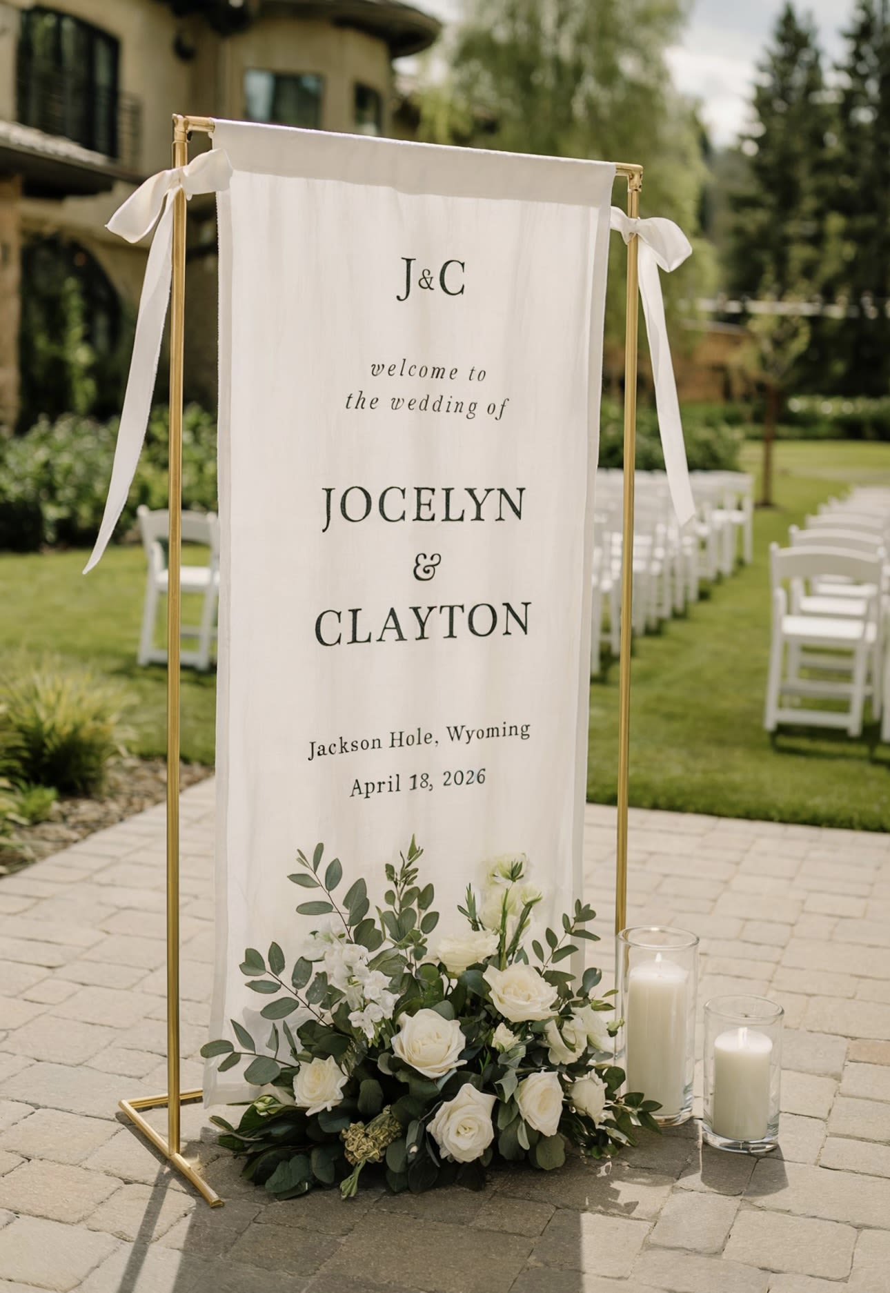 Wedding welcome sign with white flowers and candles on a gold stand