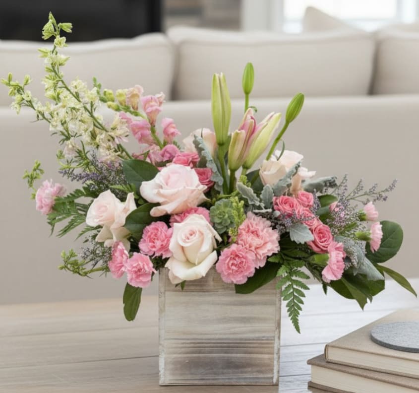 Blushwood Bloom Box - Soft pink petals, creamy roses, and elegant lilies come together in Blushwood Bloom Box. A graceful garden-style design with a modern rustic touch. Sweet, sophisticated, and perfect for celebrating life’s tender moments.