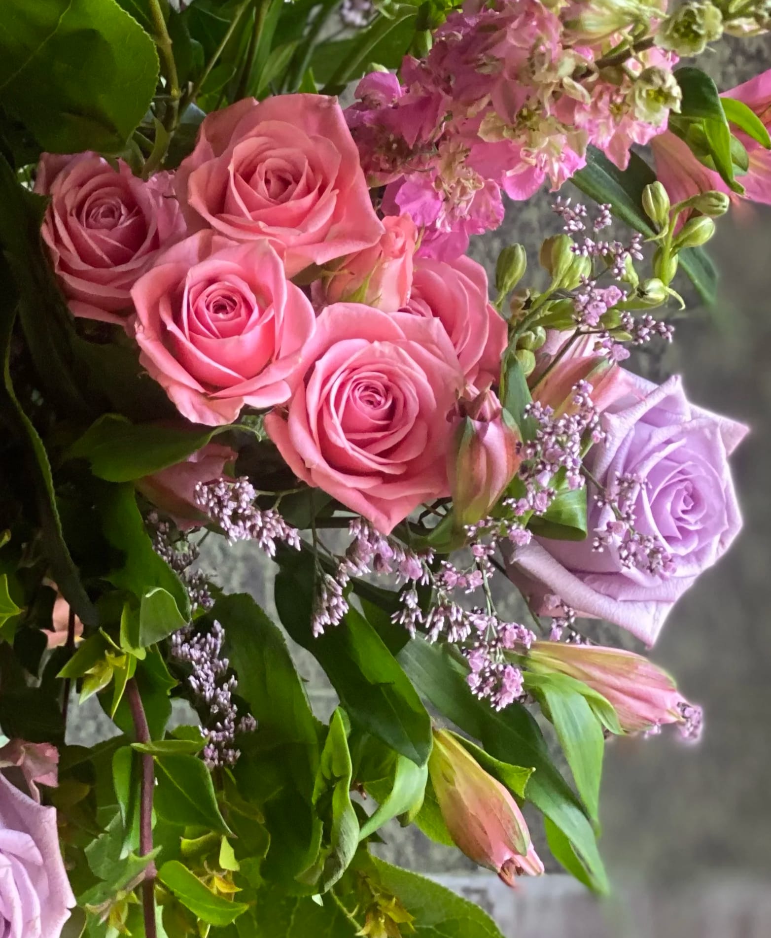 Pink and lavender roses with small purple filler flowers